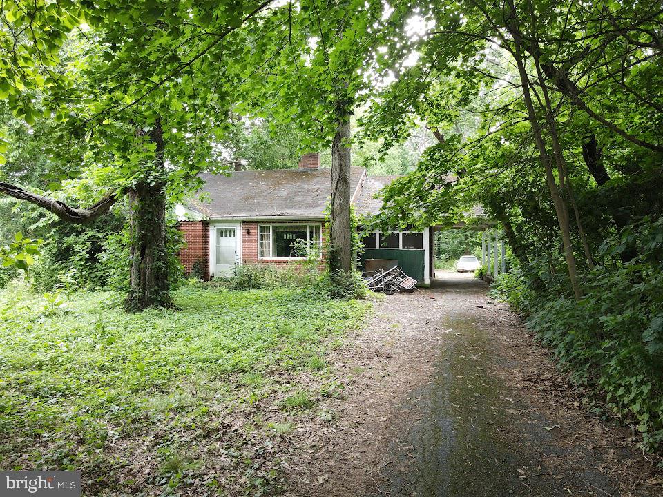 This property will be offered at Public Auction on Thursday, July 30, 2026 @ 6pm.  The listing price is the opening bid only and in no way reflects the final sale price.  10% down due at auction, 2% transfer tax to be paid by the purchaser, real estate taxes prorated. This Manheim (East Hempfield) investment 
property requires substantial renovation and should be considered a major fixer-upper. The home is in need of extensive cosmetic and functional updates throughout, making it best suited for 
investors, flippers, or buyers prepared to take on a significant rehabilitation project. Situated on a large lot, the property offers plenty of outdoor space and potential. The home includes a living room with a fireplace, eat-in kitchen, family room, two bedrooms, two bathrooms, an office, walk-up attic, and a screened-in porch. The basement is unfinished and provides additional storage space. Additional amenities include a carport. Bring your tools, ideas, and renovation expertise to restore and improve this property.