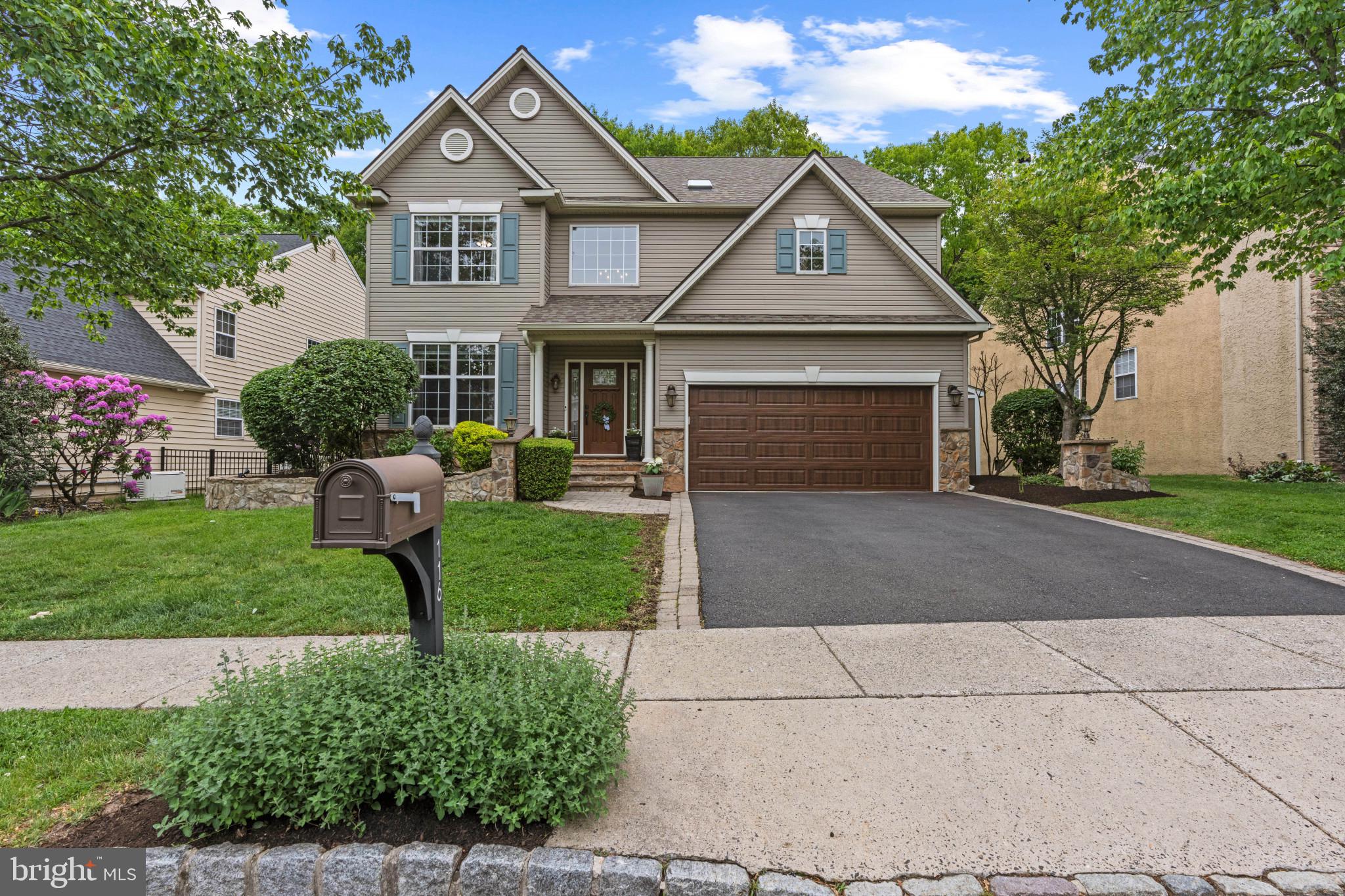 Welcome to 116 Riverwoods Drive where thoughtful design meets an unbeatable location in New Hope, Pa.  A two-story single-family residence that stands as a testament to luxury living. The location is a rare find — tucked inside the Riverwoods Community, you’re steps from the charm of New Hope and Lambertville, yet the backyard opens to quiet woods awaiting many adventures from hiking to creek exploration or a simple walk to town. This property, characterized by its exquisite design and the use of top-tier materials, is maintained in superb condition, offering an unparalleled living experience. The kitchen serves as the heart of this residence, meticulously appointed with stainless steel appliances and a double oven, catering to both culinary enthusiasts and large-scale entertaining. A grand island, featuring an integrated sink and expansive counter space, anchors the room, complemented by sophisticated stone counters and a distinctive stone wall. The custom range hood adds a refined architectural element.  The kitchen is a genuine showpiece — practical details, countless custom nooks and drawers, a large pantry, and a separate breakfast area make it as functional as it is beautiful, completing this thoughtfully designed space. The living room offers an atmosphere of refined comfort, distinguished by its 20+ foot high ceilings and elegant wall of windows bringing the privacy of the outside in.  The stone gas fireplace and wide plank hardwood flooring throughout, together create an expansive and inviting environment. 
The primary suite offers a true sense of relaxation — vaulted ceilings, dual walk-in closets with wood finish custom cabinetry, a spa-caliber bath with heated floors, frameless shower, and a jetted soaking tub; a sitting alcove overlooking the canopy of trees to complete the elevated hideaway.
The additional 3 bedrooms provide serene retreats, each benefiting from high ceilings that amplify the sense of space and light, alongside the enduring elegance of wide plank hardwood flooring. The secondary bath was built for real life — custom dual-sink vanity with pull-out steps for little ones, a fully tiled zero-threshold shower with bench, heated floors, and a skylight designed with discerning taste.  Further enhancing the property's appeal are a dedicated laundry room with ample storage and organization for convenience and an attached two car garage, offering more practical storage. Entertaining is effortless outside — a large Trex deck, a permanently plumbed gas line for grilling, and a lower level paver patio, all framed by the wooded backdrop conservancy land, on one of the most sought after lots.   The finished basement offers many options from gaming room to movie nights or extra office space, alongside a rubber floored fitness room or whatever fits your lifestyle needs. The whole-house infrastructure includes a water filtration system with softener and a whole-house generator, a newer roof, newer HVAC system and newer water heater for peace of mind. This home was built and maintained with permanence in mind — the upgrades are too numerous to capture here. A walkthrough will say the rest.  We invite you to experience the refined elegance and superior craftsmanship of this distinguished New Hope residence.