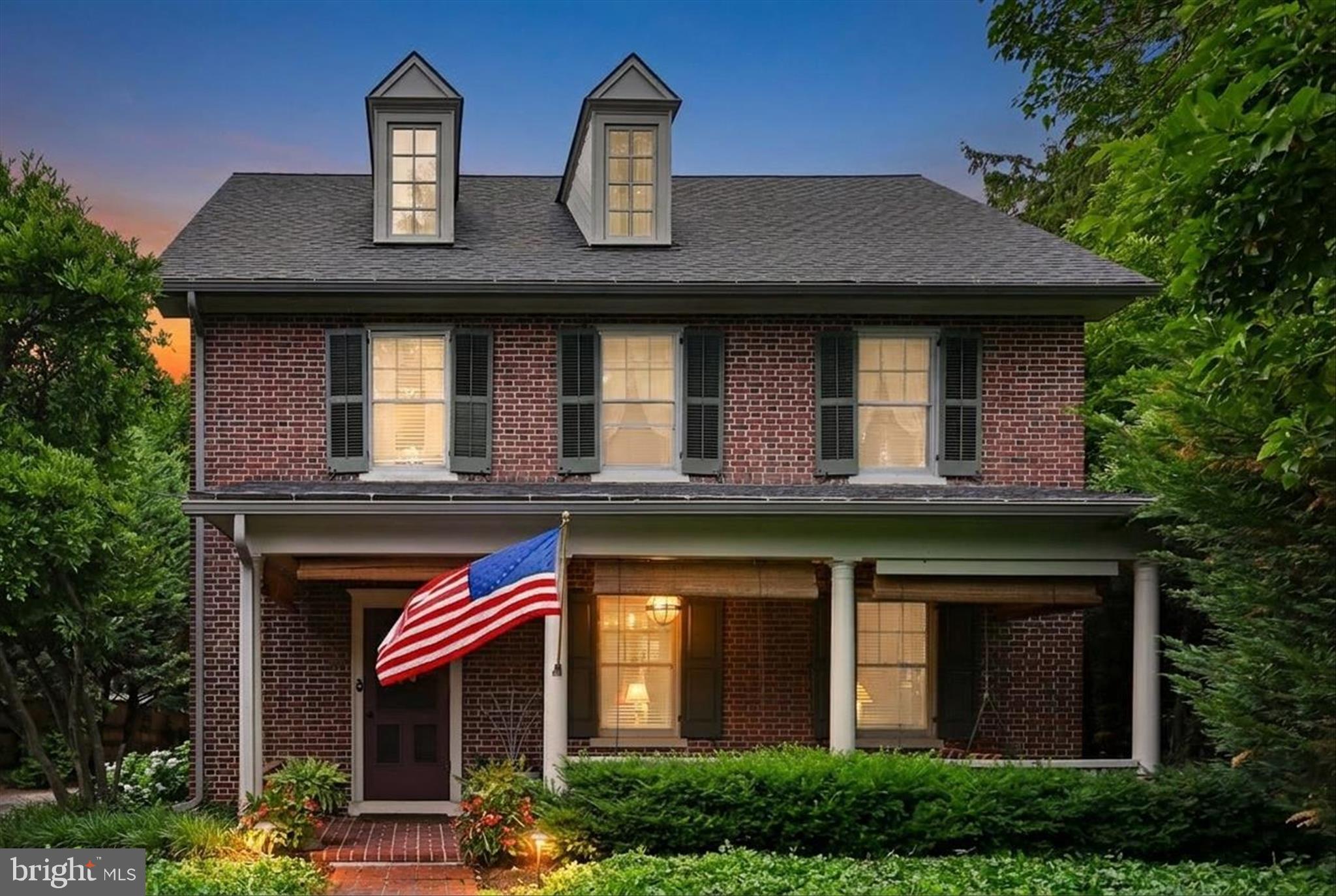 Set beneath mature trees in the heart of New Holland, this timeless brick Colonial offers classic charm, modern updates, and beautifully curated outdoor living.  This 4 bedroom, 2.5 bath home features over 2,200 square feet of well designed living space. A welcoming covered brick front porch leads into bright living and dining rooms with hardwood flooring and warm, traditional character.  The updated kitchen is the heart of the home, featuring stainless steel appliances, including a JENN AIR gas stove and double oven, a center island and abundant cabinetry. A convenient first floor laundry and powder room add everyday ease.  Upstairs, the second level offers three spacious bedrooms and a full bath. The third floor primary suite provides a private retreat complete with a walk-in closet and full bathroom.  Outside, the property truly shines. Thoughtfully designed gardens, mature landscaping, brick walkways, and a private rear patio create an inviting space for relaxing or entertaining. A detached garage and storage shed provide added flexibility for hobbies and storage.
Located in the Garden Spot School District and close to local shops, dining, and community amenities, this home offers a rare combination of charm, space, and setting.