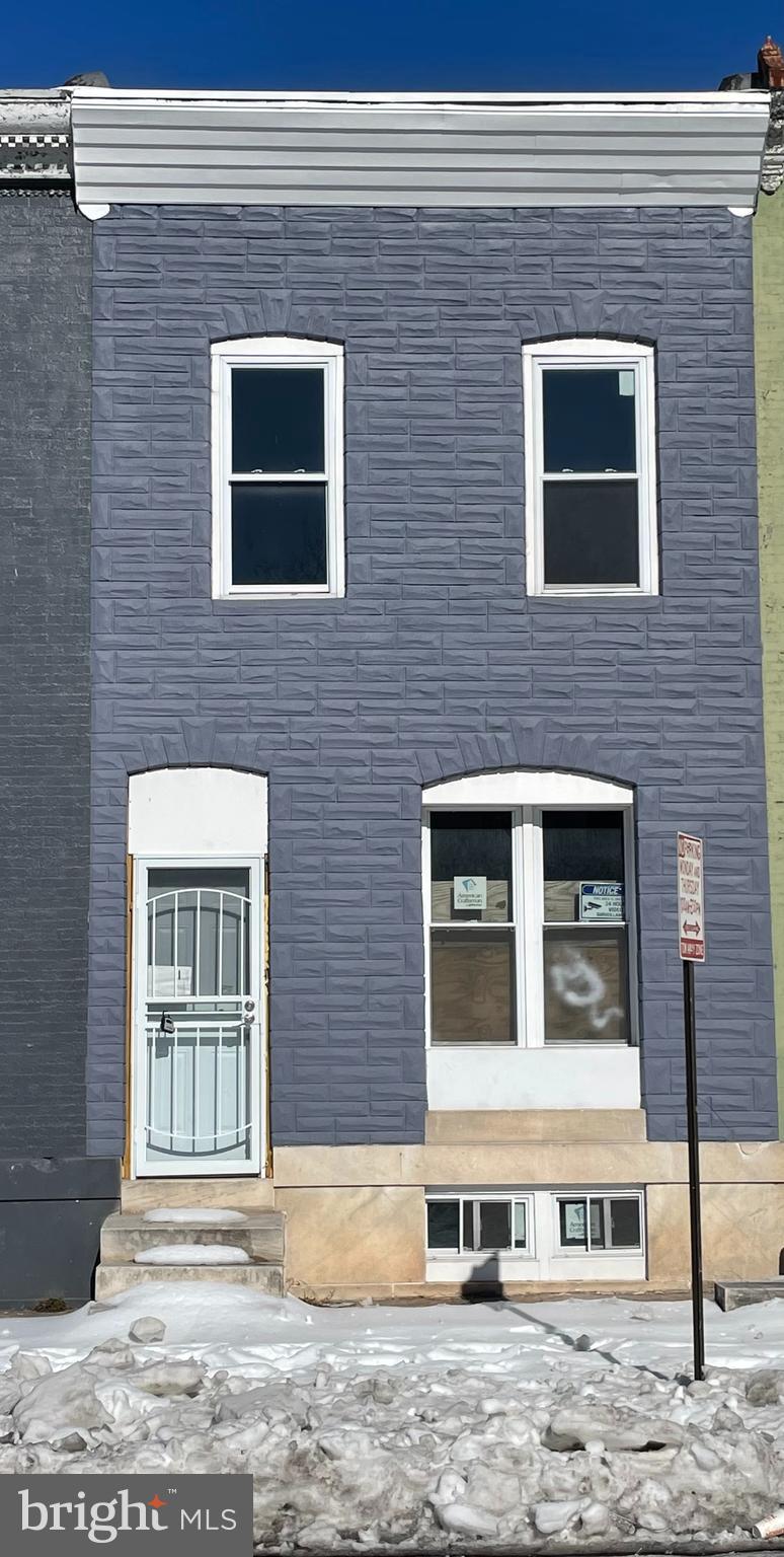 **INVESTOR OPPORTUNITY!** PRICE DROP!! $80K+ in completed gut rehab! NEW: roof, siding, windows, doors, electrical, plumbing, sewer line. Licensed contractor, all permits pulled & verifiable. Broadway East near Johns Hopkins. Approximately $40K to complete. Total basis $185K - priced at $80K for fast sale! NOT a typical distressed property - major systems DONE. Cash buyers preferred. Quick close available.  Discover a unique investment opportunity in this charming ArtDeco townhouse, built in 1900, nestled in a vibrant urban setting. With a stunning city view, this property offers immense potential for appreciation and rental income. The unfinished basement presents a blank canvas for creative renovations, allowing you to maximize the living space and increase property value. Imagine transforming this interior row home into a stylish urban retreat or a lucrative rental unit. The prime location, combined with the architectural charm, ensures strong demand from renters and buyers alike. On-street parking adds convenience, while the absence of an association fee means more profit in your pocket. Investing in this property not only secures a piece of history but also positions you for significant returns in a thriving market. Don't miss the chance to capitalize on this exceptional opportunity-your future self will thank you!