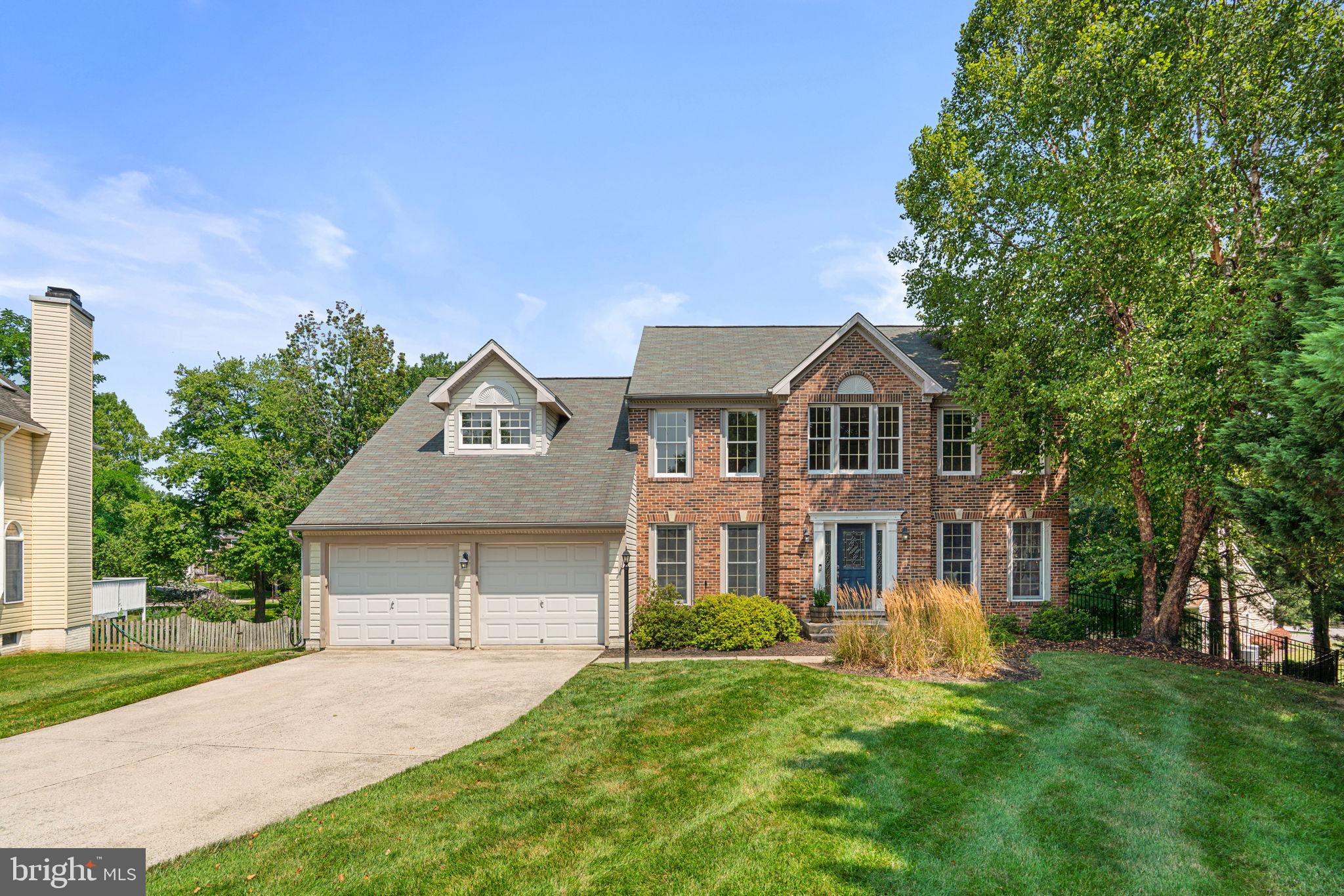 Thoughtfully updated and meticulously maintained, this exceptional home offers the perfect blend of timeless style, modern convenience, and exceptional spaces for living and entertaining. Nestled on a quiet cul-de-sac in sought-after Autumn Manor, this exceptional brick-front home offers refined living, thoughtful updates, and beautifully designed spaces for everyday comfort and effortless entertaining.
A dramatic two-story foyer welcomes you into a home where hardwood flooring flows throughout the main and upper levels. The main level features a private study with scenic views, an elegant formal living room with crown molding, and a formal dining room accented with crown molding and chair rail detailing. 
The beautifully updated eat- in kitchen blends style and functionality with quartz countertops, soft-close cabinetry, a classic white subway tile backsplash, stainless steel appliances, center island, and a farmhouse apron-front sink. The adjacent family room showcases soaring vaulted ceilings, recessed lighting, and a wood-burning fireplace, creating a warm and inviting gathering space. The expansive windows fill the room with natural light. Step outside to the large, two-tier deck overlooking mature landscaping.  It is perfect for outdoor dining, relaxing, and entertaining. A spacious main-level laundry room with a high-efficiency front-loading washer and dryer adds everyday convenience.
The upper level is highlighted by a spacious primary suite featuring cathedral ceilings, hardwood flooring, recessed lighting, walk-in closet and an additional wardrobe closet, and a beautifully renovated en-suite bath with dual shiplap vanities, quartz countertops, ceramic tile flooring, a soaking tub, and a separate walk-in shower.
Two additional bedrooms offer hardwood flooring and recessed lighting. The updated hall bath is equally impressive, featuring a dual shiplap vanity with quartz countertops, ceramic tile flooring, a skylight, soaking tub, and designer gooseneck sconces.
The finished walkout lower level expands the home’s living space with recessed lighting, shiplap accents, comfortable carpeting, abundant storage, and flexible space ideal for a recreation room, media room, home gym, playroom, or home office.
Additional highlights include a two-car garage with an epoxy flake floor, slat wall storage system, EV charger, and mature landscaping that enhances the home’s curb appeal. Welcome Home!