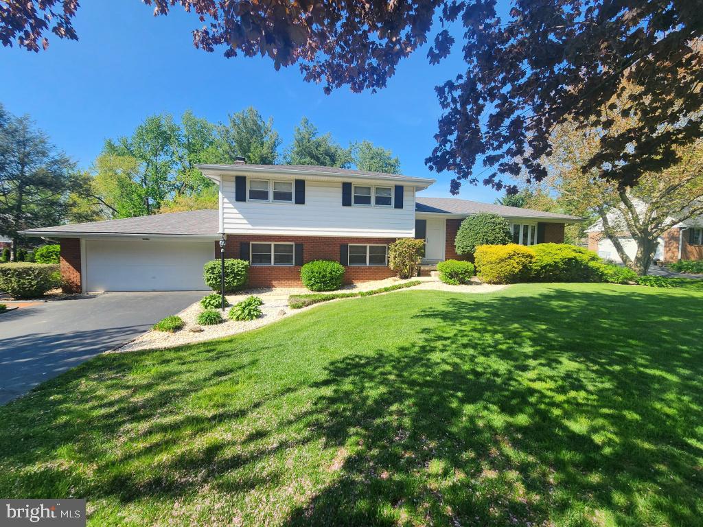 This property will be offered at Public Auction on Thursday, June 25, 2026 @ 6pm.  The listing price is the opening bid only and in no way reflects the final sale price.  10% down due at auction, 2% transfer tax to be paid by the purchaser, real estate taxes prorated. This well-maintained Hempfield home offers a spacious, flexible layout across multiple levels. The upper-level features three bedrooms, including a primary suite with its own private bathroom, along with an additional full bath. On the main floor, you’ll find a welcoming entryway, a comfortable living room, a formal dining room, and an eat-in kitchen designed for everyday convenience. The lower level includes a cozy family room with a fireplace and a bar area. Built-in bookshelves and desks add functionality, along with a powder room. This level also offers access to the garage and a sun porch. The basement adds even more living space with two additional family rooms or potential bedrooms, plus a laundry area and workshop. Additional amenities include a fenced-in yard, hot tub, and outdoor playground, offering both relaxation and recreation.