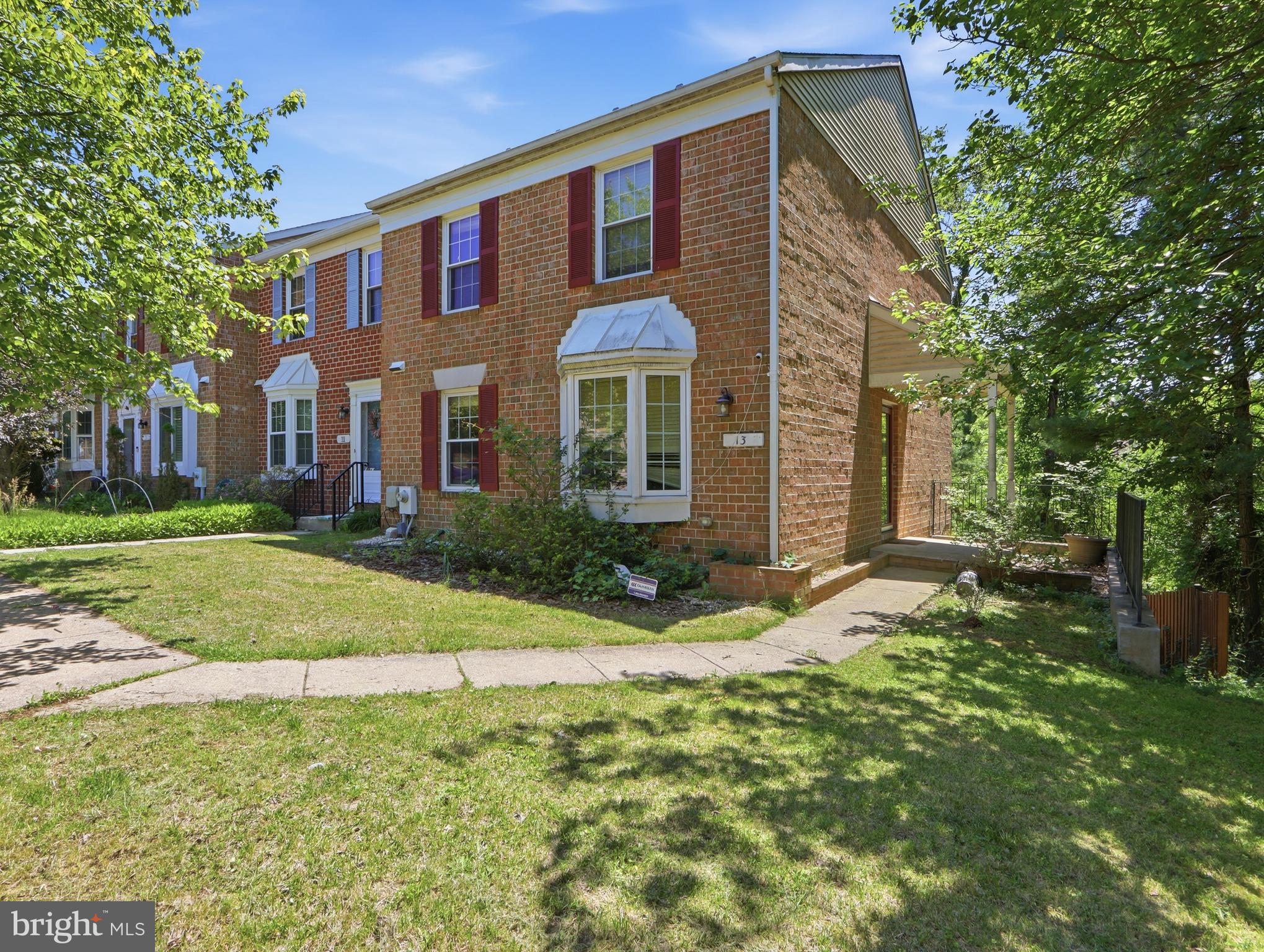 Welcome to 13 Courtwood Drive, a spacious end-unit townhouse offering comfort, privacy, and peaceful wooded views. Filled with natural light, this freshly painted home features a bright and inviting living room, spacious bedrooms, and a thoughtfully designed layout.

The updated kitchen includes a new electric range (2025), new refrigerator with ice maker (2025), and ample cabinet and counter space. A new washing machine (2025), dryer approximately three years old, and a freezer in the basement add everyday convenience.

The spacious primary suite features a private bathroom and two closets, providing excellent storage and comfort. Additional bedrooms offer plenty of space for family, guests, or a home office.

Enjoy outdoor living on the large rear deck overlooking the woods, perfect for relaxing or entertaining. The walkout basement provides direct access to the fenced backyard, creating a private outdoor space for recreation, gardening, or pets.

As an end-unit home, you'll appreciate the added privacy, extra windows, and abundant natural light throughout. Conveniently located near shopping, dining, parks, and major commuter routes.

Property is being sold As-Is.

Certain photographs have been virtually staged to help visualize the property's potential.
