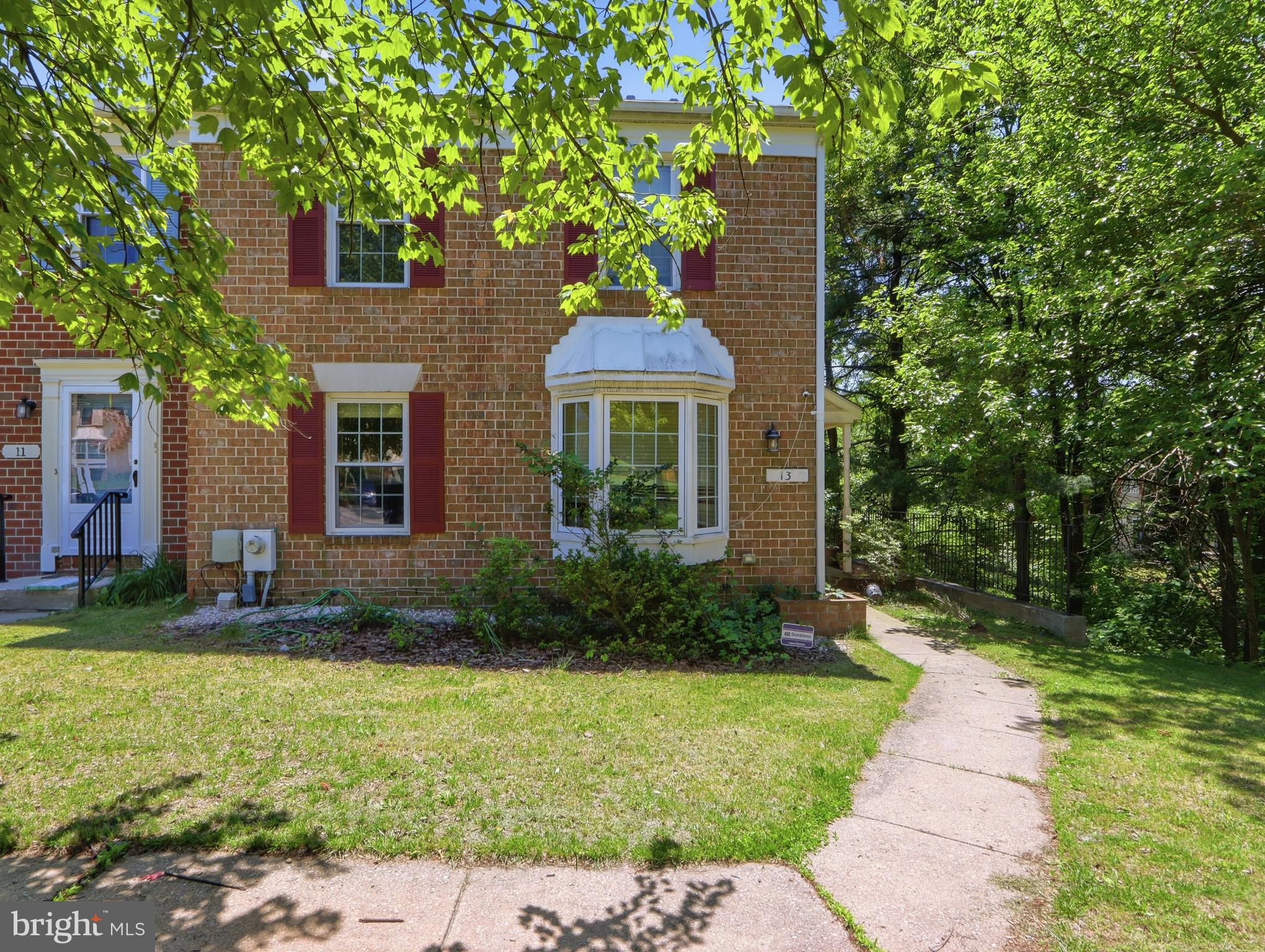 Welcome to 13 Courtwood Drive, a spacious end-unit townhouse offering comfort, privacy, and peaceful wooded views. Filled with natural light, this freshly painted home features a bright and inviting living room, spacious bedrooms, and a thoughtfully designed layout.

The updated kitchen includes a new electric range (2025), new refrigerator with ice maker (2025), and ample cabinet and counter space. A new washing machine (2025), dryer approximately three years old, and a freezer in the basement add everyday convenience.

The spacious primary suite features a private bathroom and two closets, providing excellent storage and comfort. Additional bedrooms offer plenty of space for family, guests, or a home office.

Enjoy outdoor living on the large rear deck overlooking the woods, perfect for relaxing or entertaining. The walkout basement provides direct access to the fenced backyard, creating a private outdoor space for recreation, gardening, or pets.

As an end-unit home, you'll appreciate the added privacy, extra windows, and abundant natural light throughout. Conveniently located near shopping, dining, parks, and major commuter routes.

Property is being sold As-Is.