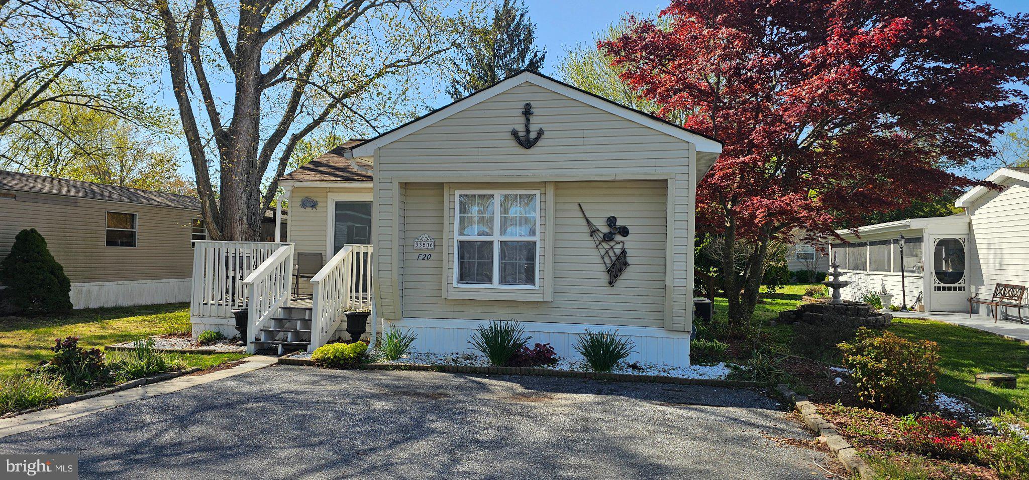 This home in Angola Beach has reduced the price in time for you to enjoy easy coastal living in the desirable waterfront community that boasts 2 swimming pool, two playgrounds, boat docking and fishing.  This well-maintained 2-bedroom, 1.5-bath single-wide home offers a split floor plan for added privacy and comfort. Enjoy outdoor living on the composite deck, perfect for relaxing or entertaining.

Inside, the home features a one-year-old furnace for peace of mind and mini-blinds built directly into the glass doors, providing a clean, modern look with low maintenance.

Angola Beach offers exceptional amenities, including two swimming pools, basketball and tennis courts, a playground, marina, and clubhouse, all within a vibrant waterfront setting.

Ideally located just 10 miles from Rehoboth Beach and 15 miles from Delaware Seashore State Park, this home is perfect as a year-round residence or coastal getaway.

Affordable coastal living with resort-style amenities—schedule your showing today!