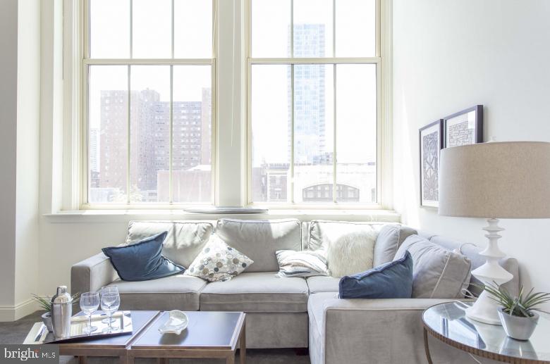 Now offering one month free on a 13 month lease, with a lease start date by 6/1/25! Enjoy living in this former tuxedo warehouse which has been transformed into fabulous loft style apartments! 2121 Market Street Apartments offers stunning city views!  Located in the Rittenhouse Square neighborhood, the spacious apartments feature super high ceilings with expansive 14-foot windows, hardwood floors, open floor-plans and amazing natural light.  The kitchens are fully equipped and include a breakfast bar. Amenities include a resident sky box with a state of the art fitness center and resident lounge, roof deck with breathtaking city views, 24/7 front desk attendant.  We love pets! The building is super pet friendly and welcomes dogs and cats. Trader Joe's is conveniently located on the lower level.  Enjoy everything that the city has to offer at 2121 Market Street. **Photos pictured are of the model unit with a similar floor-plan**
