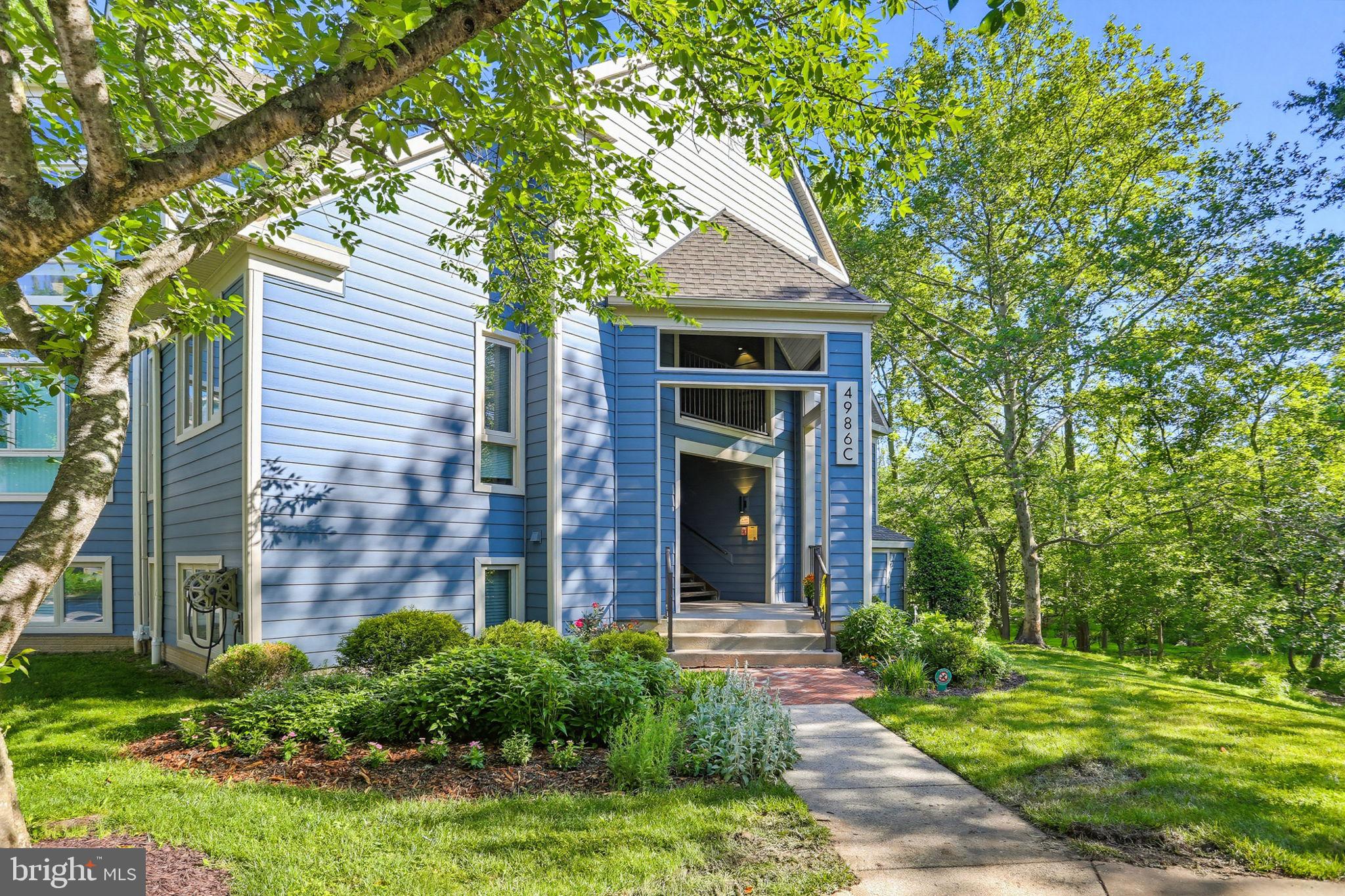 Welcome to convenient living in desirable Dorsey Hall! Sliding doors lead to a private patio overlooking  a serene wooded area - perfect for morning coffee or unwinding outdoors. Enjoy a three-sided fireplace from the living room, dining room or kitchen. Newly installed HVAC system (May 2026), This home offers ground-level living, a functional layout for today's lifestyle, a full-sized washer and dryer and SO MUCH MORE! Just one mile from Centennial Lake, enjoy access to scenic walking paths, boating, tennis courts, playgrounds, picnic pavilions, basketball courts, and a nature preserve.  The condo fee provides peace of mind by
covering all exterior maintenance, lawn care, and snow removal, making this an excellent option for
homeowners and investors alike. Turn-key, well-located, and packed with amenities—this is an outstanding
opportunity in one of Ellicott City’s most desirable communities. Property sold as-is, seller will make no repairs. Priced competitively for today’s market. Act quickly—this one won’t last!