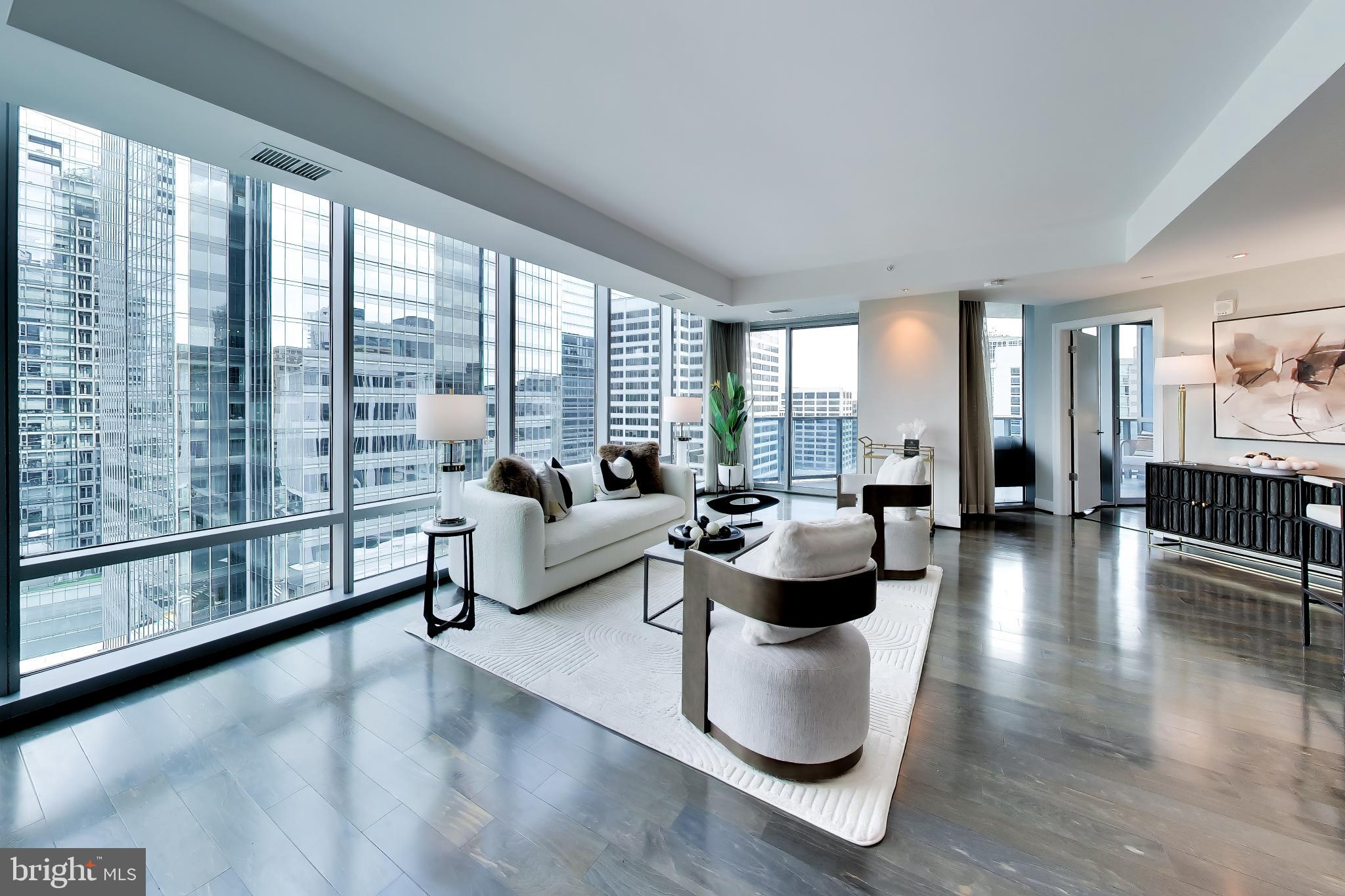 Experience elevated living at Turnberry Tower, the crown jewel of Rosslyn. Arrive directly into Unit 1403 via your private elevator entrance, where exceptional luxury and privacy unfold at every turn. Bathed in morning light, this elegant residence opens to a 240-square-foot private balcony with breathtaking sunrise  views, seamlessly extending the living space outdoors.

Inside, floor-to-ceiling windows fill the home with natural light, while the gourmet kitchen is thoughtfully designed for both beauty and function - ideal for everything from casual mornings to refined entertaining. 
There are custom hardwood flooring & Italian tiled terraces. The primary suite is a true retreat, offering direct balcony access and a serene connection to the home's stunning views. An elegant second bedroom  provide flexible space for guests, a den, or a sophisticated home office. A separate in-unit laundry room adds everyday convenience.

Life at Turnberry Tower is defined by white-glove service and unmatched 5 star amenities, including 24-hourfull service  concierge,  doorman,  valet parking, on-site management, a state-of-the-art fitness center, yoga studio and a resort-style indoor pool & spa. Perfectly located in the heart of Rosslyn, this extraordinary home offers a rare blend of luxury, service, and location just moments from the best of the city.