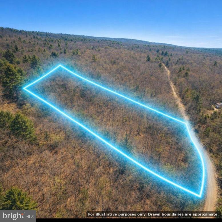 Discover 5.25 UNRESTRICTED acres in the peaceful Valley High Timber Farms community of Great Cacapon, West Virginia. With no HOA and plenty of wooded privacy, this versatile property offers an ideal setting for a full-time residence, weekend cabin, recreational retreat, hunting property or private campsite.

Enjoy the freedom to create your own mountain getaway surrounded by nature and abundant wildlife, including deer, turkey and occasional black bear. Whether you are looking to build, camp, hunt or simply invest in your own piece of West Virginia, this affordable acreage offers space, seclusion and endless possibilities.

Well and septic will be needed."
