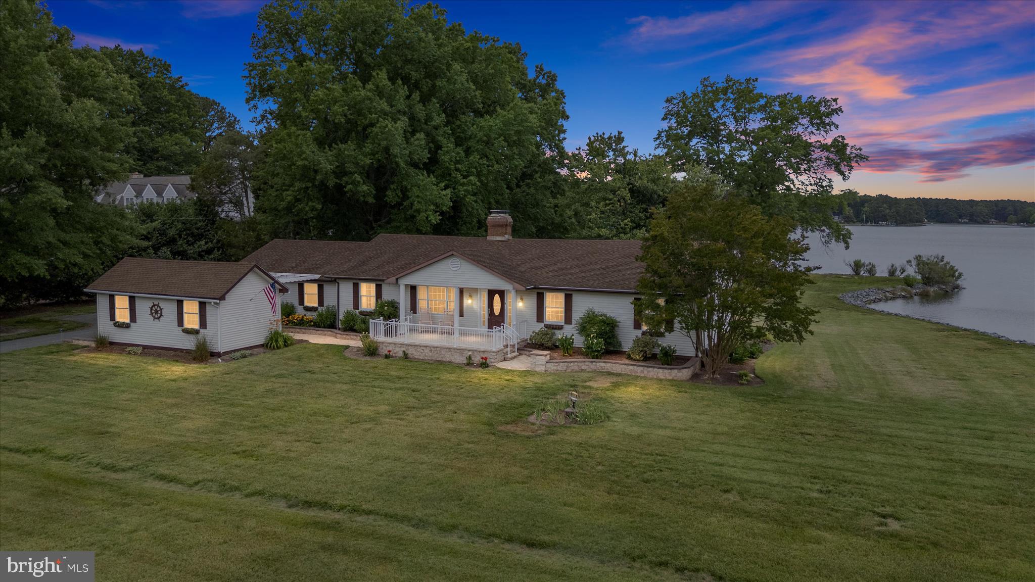 A wonderful opportunity to purchase an amazing one story waterfront home on an expansive 2.5 acre lot with western exposure on Broad Creek.  Many upgrades have been done to make this a special home to enjoy your life of relaxation  and pure enjoyment on the Eastern Shore of Maryland!  Mount Pleasant is a  very sought after St Michaels  neighborhood  with close proximity to the downtown historic area of great restaurants, museums and boutiques but no town taxes!
You will love the upgraded gourmet kitchen with granite countertops, large center island, broad water views  with Samsung  stainless steel appliances where you can make your favorite dishes to enjoy.  Besides the kitchen, the large Sunroom is the my other  favorite room of the home with large windows on three sides for panoramic water views to enjoy nature, sunsets and waterfowl along with  great access to the wrap around waterside deck through sliding glass doors.  You will find a bonus of lovely hardwood floors throughout the home and 2 full upgraded bathrooms as well as a double sided wood burning fireplace for the cooler nights on the Shore and we all know that last winter was colder than most so it was very much enjoyed!
The property includes a heated workshop for hobbies as well as 2 other sheds for extra storage should you need it but also a screened waterside Gazebo for entertainment, wraparound deck, covered front porch and a deeded private dock on Broad Creek with 3+ MLW with multiple slips, a boat lift and a great place to catch some fresh crabs for dinner!
What are you waiting for? This could be the one you have been waiting to come on the market!