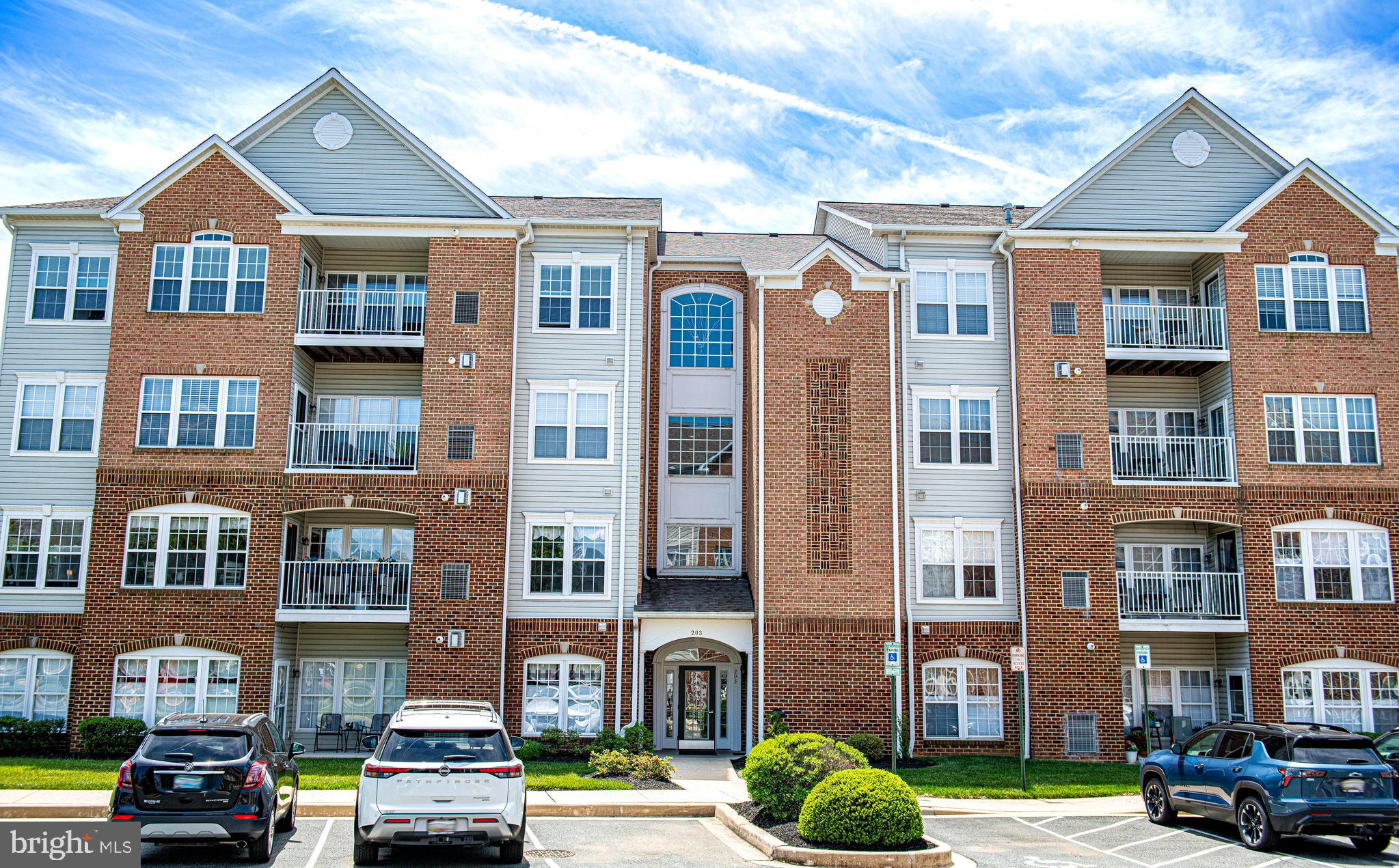 Beautiful 2nd floor elevator condo in Bulle Rock with plenty of upgrades including crown molding throughout. Take a look at the pictures! Lots of windows and natural light! Hardwood foyer includes both a coat and storage closet.  Sunlit living room features a beautiful corner gas fireplace with marble hearth and colonial mantel.  Spacious dining room with chair railing. Kitchen features upgraded maple cabinets, Domco vinyl flooring, Corian countertops, porcelain double-sink stainless steel appliances (5/24), upgraded lighting and attached pantry.  Plenty of space in the adjacent sunroom which leads to a private balcony.  Primary suite boasts a large sitting room and walk-in closet.  Attached bath includes a soaking tub, separate shower (new seamless shower door 5/26), double cultured marble sinks and upgraded white cabinetry.  Spacious second bedroom includes double-door closet and double windows. Spacious second bathroom with shower/tub combo, linen closet, cultured marble sink and upgraded white cabinetry. The Resident's Club offers endless opportunity and amenities to enjoy.  There is a $250 move in out fee. Indoor and outdoor pool, billiards room, tennis and pickle ball courts, state-of-the-art fitness center, game room, sauna, steam room and a hot tub, walking and biking trails and more.  If golf is what you desire there is an 18 hole golf course.