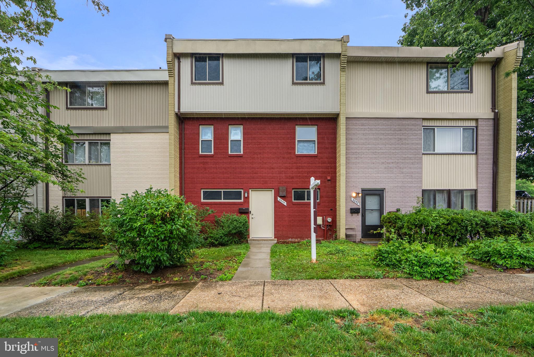 Welcome to this 3/4 bedroom, 2.5 bath, 3-Level Interior Townhome located near NASA, Eleanor Roosevelt, all major transportation routes (295, 95, 495), public transportation and all necessary amenities!  Move right into this ground level entry home. Flex rooms on the entry level allow for a  family room and a guest bedroom and it includes a workroom/utility room w/washer & dryer and additional storage space.  Connecting stairs lead you to the 2nd level which features a kitchen with stainless steel appliances, a dining room, the living room with a sliding door rear exit to a patio and a partially fenced yard. Unassigned parking is available right out your door so bringing your groceries in at ground level is a breeze.  The upper level boasts a primary bedroom with ensuite shower bath, two additional bedrooms, a hall full bath and a linen closet. Furnace (2020), Washer and Dryer (2022), Dishwasher (2022), Exterior Siding (2025). Interior Renovations (2026) including fresh paint throughout all three levels, renovated Primary bath, new carpet, new laminate flooring and an updated kitchen.  There is no better value than this!