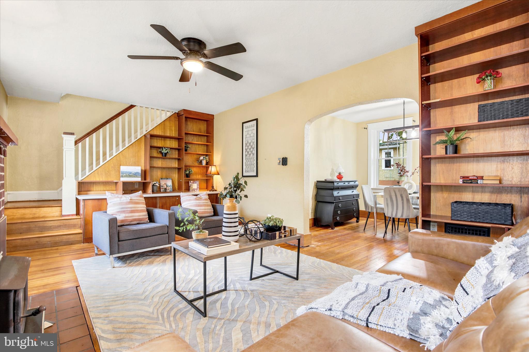 New to the market, this 3 BED, 2 FULL BATH COTTAGE is an absolute gem in Bedminster Village. This home has it all - a simple floor plan with understated modern elegance, and backyard splendor for barbequing with the quietest of neighbors- natural wooded farmland. Situated on a .25 acre lot, this home blends the best of modern comforts with old world, retro charm.  The NEWLY UPDATED KITCHEN and PANTRY/BREAKFAST BAR area is brightly situated with backyard views and bay windows. Gorgeous wide-tiled neutral stone flooring further elongate the space. Equipped with new white shaker cabinets, new stainless steel appliances, quartz countertops and  green tiled backsplash, it invites the outdoors in while cooking and gathering into the adjacent dining room or spilling outdoors onto the patio. The NEW 1st FLOOR GUEST BATH w. shower stall completes the functionality of this area with separate private entrance to bring in the groceries.  This  home features an ADDITIONAL FLEX ROOM on 1st floor that can serve as guest bedroom / office / den area;  it has  NEW & REFINISHED HARDWOOD FLOORS with custom wooden millwork throughout. The living room offers an elegant entrance- high ceilinged with skylights and plenty of natural light  - it generously flows into the family/den and dining /kitchen areas.  The family room becomes the heart of the home with wood burning fireplace, custom built in bookshelves and a media console by the staircase leading to the second floor. Upstairs you'll find a spacious primary bedroom next to a NEWLY TILED RETRO BATHROOM accented  w. honeycomb flooring, vanity and updated lighting. Adjacent are two additional bedrooms with custom daybed with shelving, and an attic w. additional storage.  The driveway can stack three+ cars parked and leads to backyard garage / storage shed. Basement offers additional storage. Local creeks, trails and conveniences are within minutes reach in Plumstead and Hilltop Townships. Local Penn Vermont Fruit Farm, Plumsteadville Inn, Salt Box, Giant supermarket, with dining and shopping nearby on 611/Easton Rd.