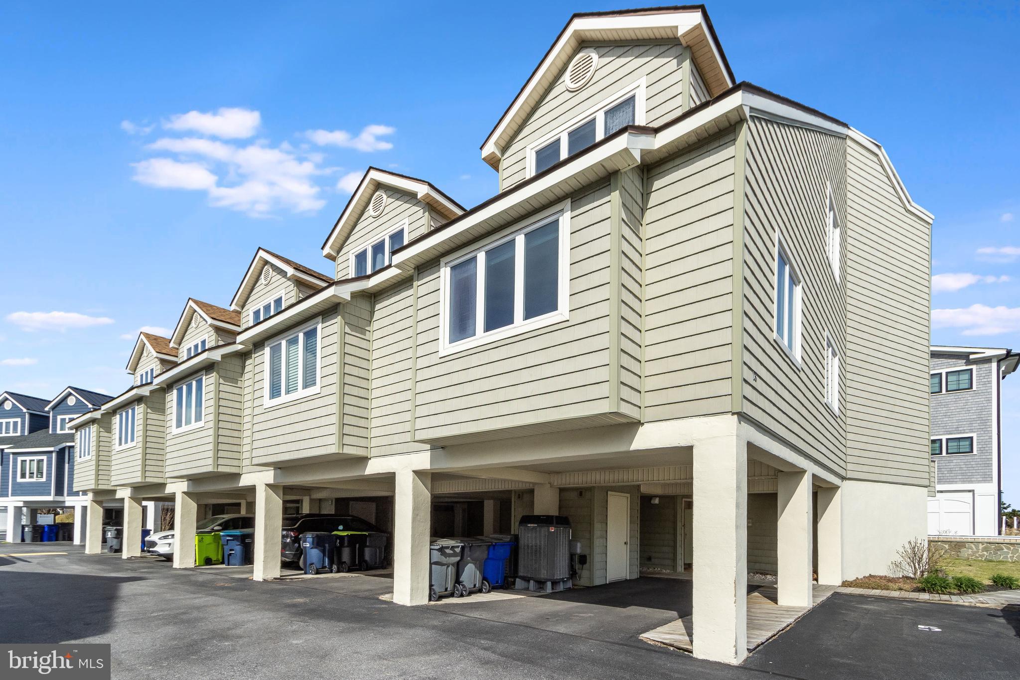 Welcome to your quintessential Dewey Beach retreat—just steps from the sand and ideally positioned in an exclusive ocean block setting. This spacious 4-bedroom, 3.5-bath end-unit townhome offers approximately 2,000 square feet of coastal living in the heart of all that Dewey has to offer. Designed for both relaxation and entertaining, this four-level home features private outdoor space on every floor culminating in an expansive rooftop deck with brand new Duradek. This top-level retreat is truly a standout feature, complete with a wet bar and full-size refrigerator, creating the perfect setting for hosting, sunset cocktails, and enjoying ocean breezes after a day on the beach. Inside, the layout is thoughtfully designed to accommodate beach living at its best. The entry level includes a convenient bedroom and dedicated laundry area—ideal for managing sandy towels and post-beach cleanup—along with easy access to the outdoor shower. The main living level offers an open-concept kitchen, dining, and living space filled with natural light, while upper levels provide comfortable accommodations for family and guests, including a spacious primary suite. This home comes fully furnished right down to the plates and dishes—making it truly turnkey. Just bring your suitcase and start enjoying coastal life immediately. Additional highlights include three dedicated parking spaces (a highly valuable commodity in Dewey Beach), two sets of washers and dryers for added convenience, and numerous recent upgrades, including newer windows and a new sliding glass door. While never rented, this property offers exceptional rental potential given its unbeatable location—just steps to Dewey’s popular beaches, restaurants, and nightlife. Whether you're seeking a personal beach getaway or a high-performing investment opportunity, this is coastal living at its finest in one of Delaware’s most vibrant seaside communities.
