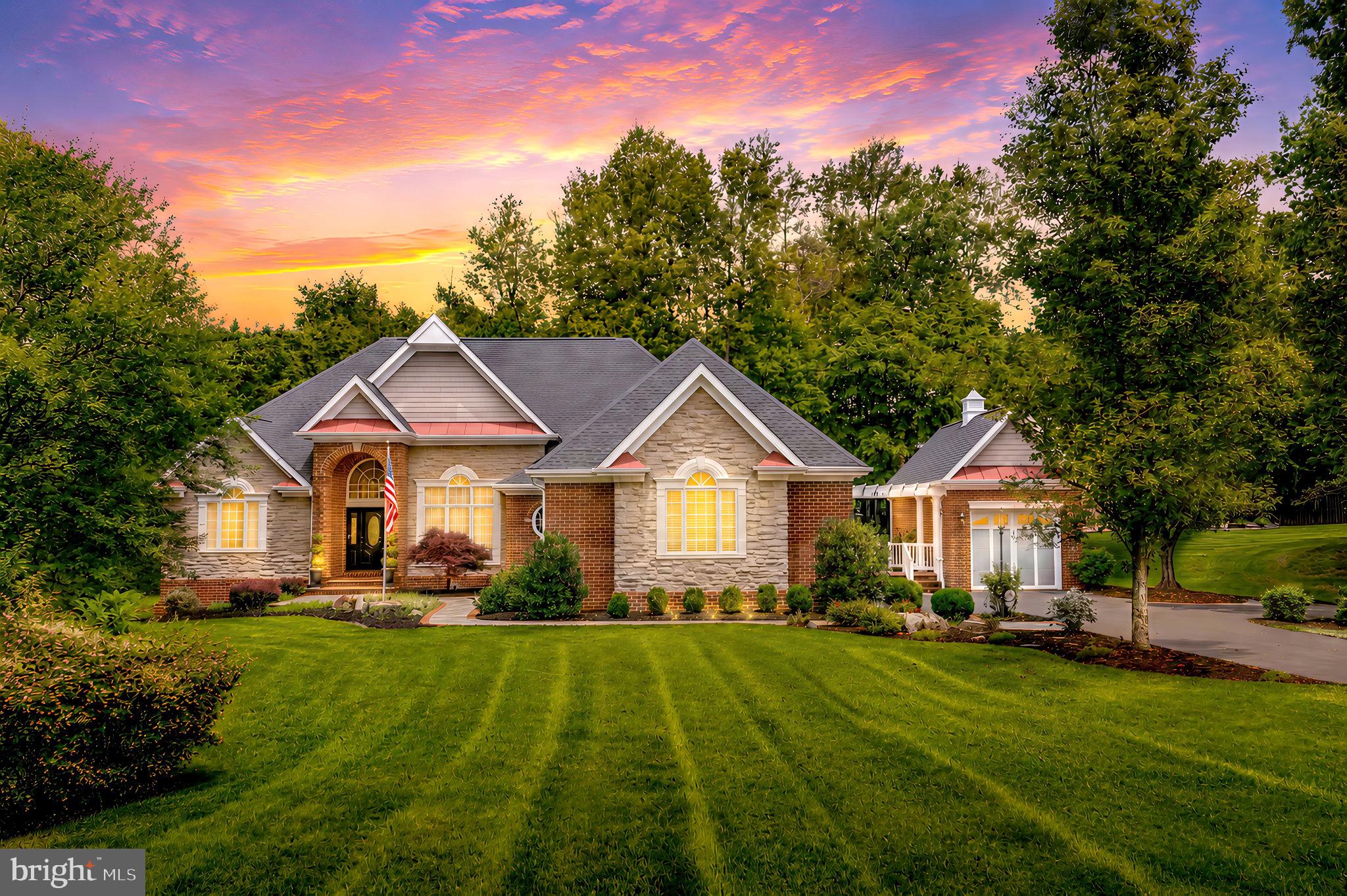 This stunning all-brick and stone rambler was an orignal Mike Garcia Construction model home and showcases exceptional craftsmanship throughout, perfectly situated on a private 1.8-acre lot. 

From the moment you enter, you’ll notice the elevated finishes and thoughtful design—extensive custom trim work, New England Classic paneling, faux-finished walls, recessed ceilings with integrated lighting, arched passageways, built-ins, rich hardwood flooring, ceramic tile, and a striking stone fireplace. Varied ceiling heights throughout the home create distinct and inviting living spaces with unique character in each room.

The main level offers true one-level living with a spacious primary suite and an additional generous guest suite, providing comfort and flexibility for owners and guests alike.

A private elevator leads to the spectacular lower level—an entertainer’s dream. Here you’ll find a handcrafted solid oak bar perfect for hosting, a wine cellar for your collection, a large media room for movie nights, and a dedicated exercise room with a full wall mirror. The lower level is completed by two additional bedrooms with walk-in closets and a full bathroom, offering excellent space for extended guests or multi-generational living.

Exterior features include a two-car attached garage plus a separate one-car detached garage—ideal for storage, hobbies, or additional vehicles. The property offers abundant parking and privacy surrounded by mature landscaping. A whole-house Generac backup generator provides added peace of mind and uninterrupted comfort year-round.  Roof 2 years old, Hot water heater 2 years, HVAC 2 zone 4 years.  WhisperKOOL cooling system conveys with the property and is included in the sale. Seller makes no representation or warranty regarding its condition and it shall convey strictly As-Is.

Conveniently located just minutes from major commuter routes with easy access to Clifton, VRE stations, commuter lots, shopping, and dining, this home offers both luxury and accessibility.

A rare opportunity to own a truly custom estate home—this one must be experienced in person to fully appreciate.