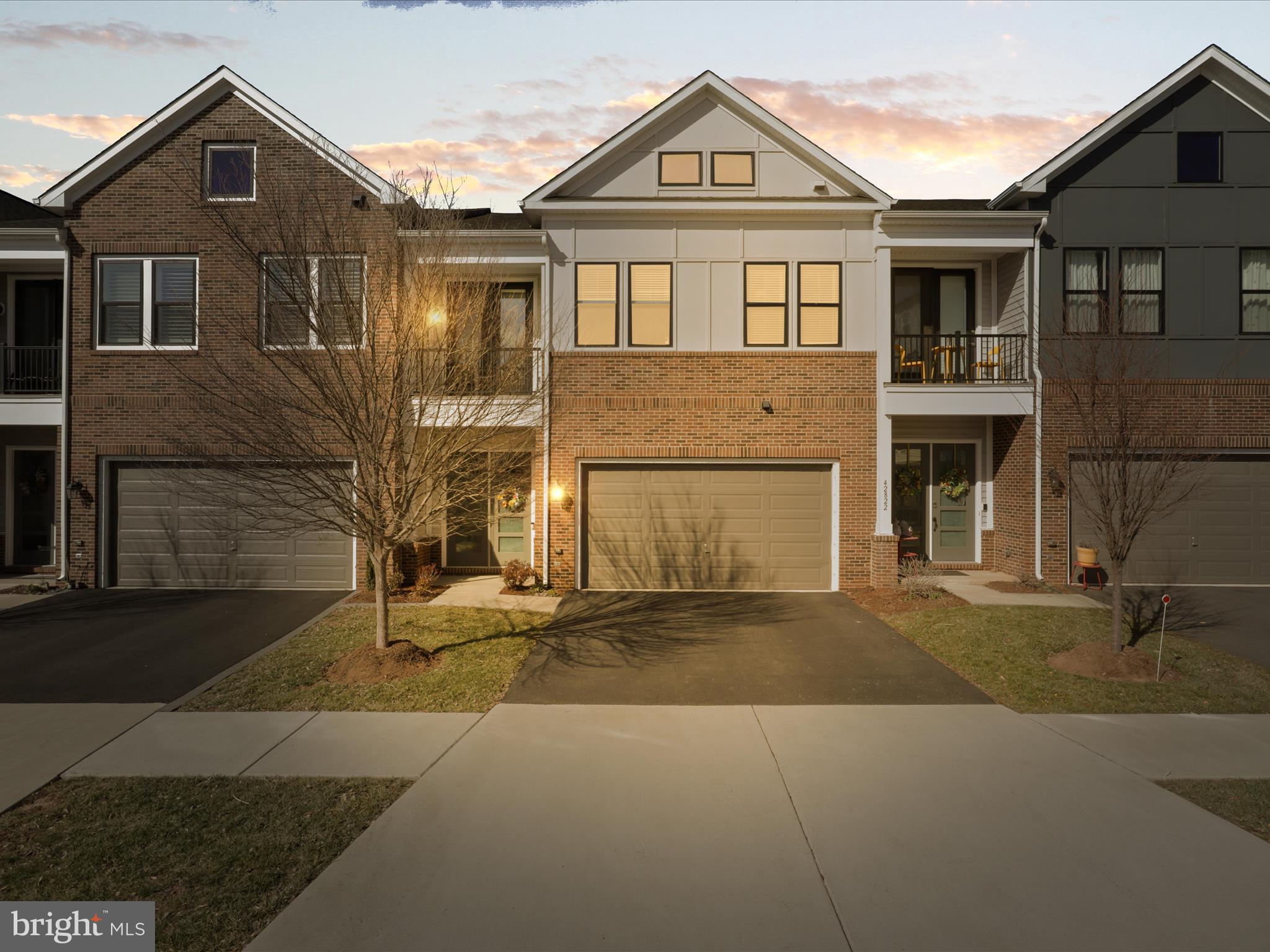 Welcome to this beautifully designed home in the highly desirable serene 55+ community of Birchwood at Brambleton. This house features well designed floor plan including three spacious bedrooms, two full bathrooms, and one half bath, providing ample space and comfort. Enjoy the open-concept layout that seamlessly connects the living, dining, and kitchen areas, making it ideal for gatherings and entertaining guests. The spacious gourmet kitchen is perfect for culinary enthusiasts with quartz countertops, expansive island, stainless steel appliances and gas cooktop with modern exhaust fan. The master suite is located on the entry level, offering a walk-in closet, a luxurious en-suite bathroom with dual vanities and a step-in shower with beautiful tile and bench.  Laundry room is conveniently located on the main level separated from the living area by a nicely designed barn door. Upper level features a loft area that can be used as a den or office, a spacious storage room, two additional bedrooms and a full bath. Walk out to the backyard with large concrete patio, privacy fence, and small area of grass to maintain. Large 2-car garage with epoxy flooring provides ease of maintenance and a lot of space for your personal properties. 

The community amenities offer an impressive 20,000 sq ft clubhouse, indoor/outdoor pool, demonstration kitchen, exercise room, and pickleball/bocce courts are just a few of the many amenities along with activities, social events and many clubs/interest groups. Nearby are parks with biking/walking or nature trails at nearby Stream Valley Park, Beaverdam Reservoir and Hanson Regional Park. Shuttle bus service to Ashburn Station Metro to go straight to Washington DC.