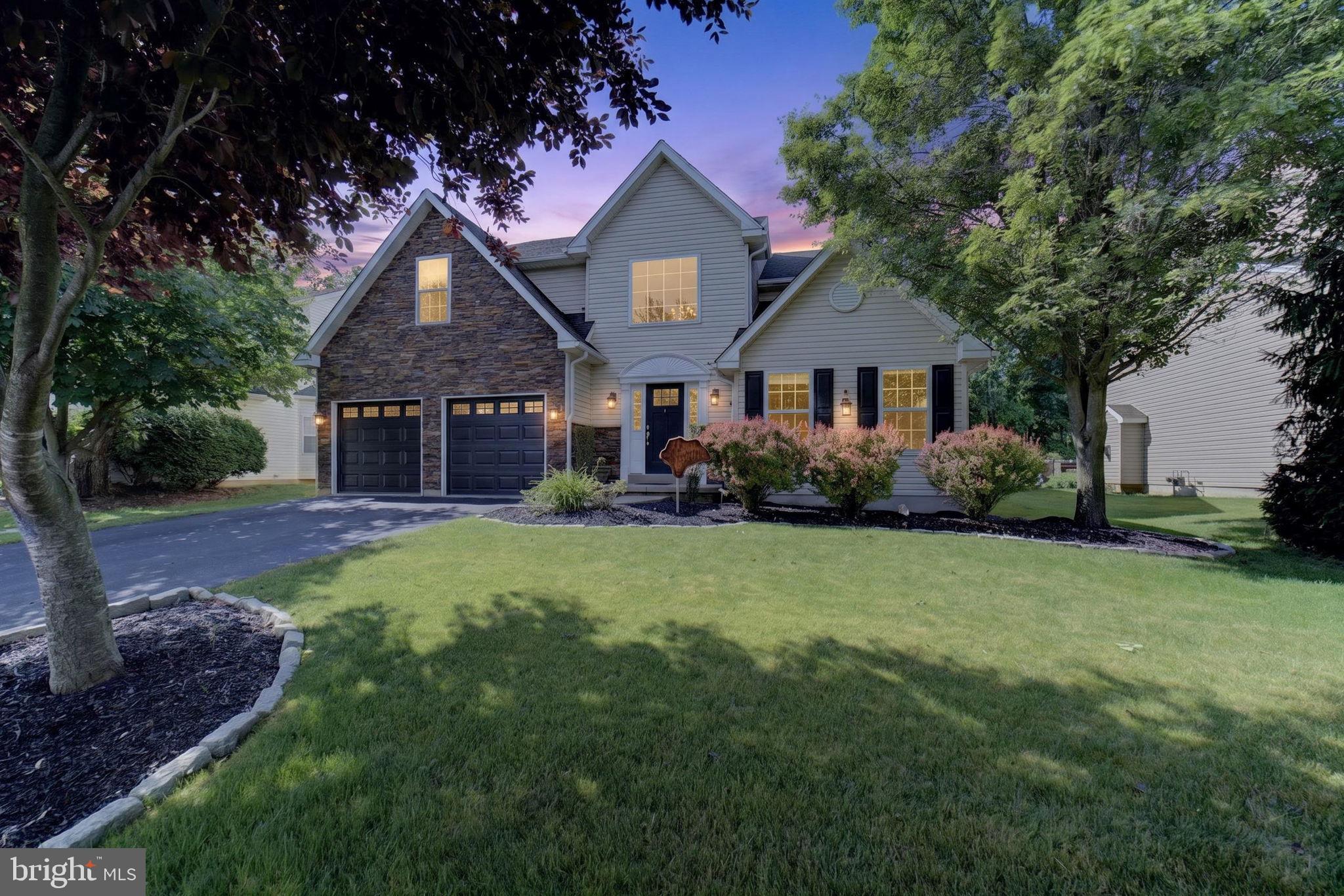 Welcome to this beautifully updated home in the desirable Hills at Lock Ridge community. As soon as you step through the front door, you're welcomed by a stunning custom wood staircase, beautiful hardwood flooring, and exceptional custom woodwork crafted from a 205-year-old sycamore tree, adding unique character and craftsmanship throughout the home. This spacious residence offers 5 total bedrooms, including a convenient first-floor bedroom with potential for an in-law suite, providing flexibility for multi-generational living, guests, or a home office. The home features generously sized bedrooms, including a spacious primary suite, along with a beautifully remodeled bathroom offering a luxurious, spa-like shower experience. The current second-floor laundry area is located in one of the bedrooms and can easily be converted back to a fifth bedroom if desired. For added flexibility, the first floor is already equipped with a dryer vent, electrical, and gas connections, offering the potential to create a first-floor laundry area. The kitchen is equipped with stainless steel cabinetry, creating a distinctive and durable workspace. Most of the home underwent a comprehensive renovation in 2020, including a new roof, electrical system, HVAC system, fencing, steel beam installation in the garage, HVAC system, and numerous additional improvements, providing peace of mind for years to come. Step outside to enjoy the large gazebo-covered deck featuring a Trex Select two-tone design in Whiskey Barrel and White, creating an exceptional outdoor living space ideal for entertaining or relaxing. The fully fenced backyard and mature privacy trees further enhance the property's private setting. Additional features include 2.5 baths, a gas fireplace, full-height 10-foot poured concrete basement walls, and access to outstanding community amenities, including basketball courts, a baseball field, tennis courts, and more. Don't miss this rare opportunity to own a beautifully updated home that blends custom craftsmanship, thoughtful upgrades, modern conveniences, and exceptional community living in the sought-after Hills at Lock Ridge.