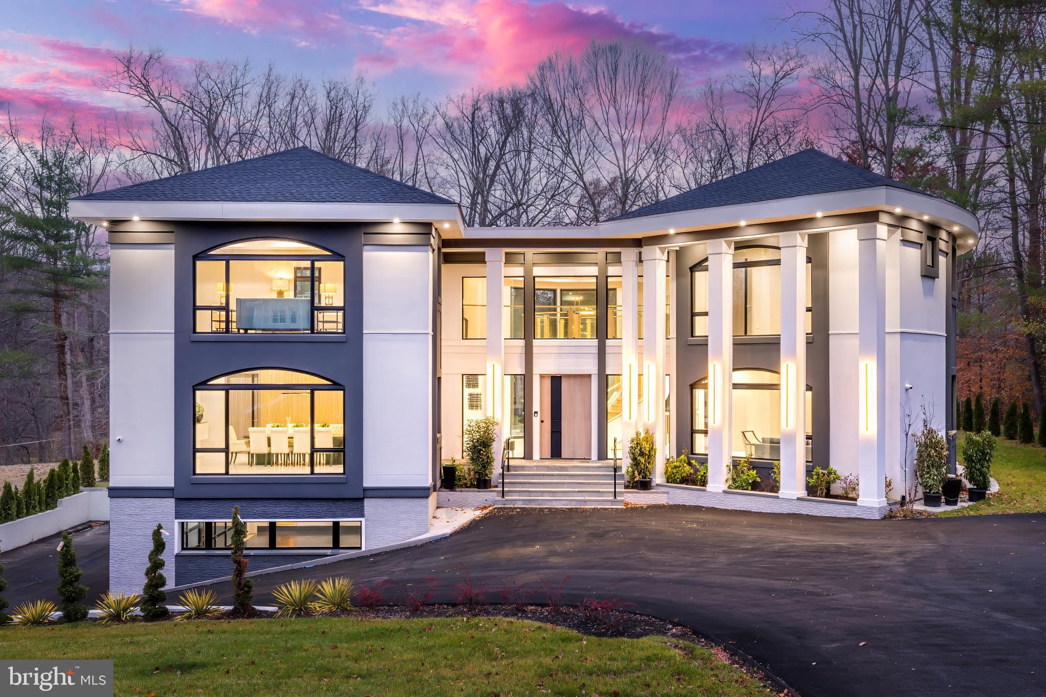 Newly completed and ready for immediate occupancy, with large private lot and ample space for a pool. This cutting-edge contemporary masterpiece by Botero Builders blends unparalleled craftsmanship with a most sophisticated & custom European design, and is the BEST VALUE/ SQFT ON THE MARKET.  An abundance of natural light fills over 10,000 square feet of both grand & intimate living spaces, featuring 6 bedrooms, 7 full baths, and 2 half baths.  This home epitomizes contemporary luxury with modern amenities. The impressive entry showcases an award-winning staircase with the added convenience of an elevator to all  three floors. The open concept offers an expansive dining room with custom built-ins. The gourmet kitchen has double islands,  premium Wolf and Thermador appliances, with a large pantry, ideal for a future spice kitchen, and seamlessly blends into the spacious living room and breakfast area.  A versatile office, which can also serve as a fifth bedroom, completes the main level. On the upper level, each bedroom is a private retreat, featuring panoramic vistas, ensuite baths, and generous walk-in closets. The primary suite is a sanctuary of elegance, offering two lavish dressing rooms, a serene sitting area, and a spa-like bath with a steam shower, double vanity, and luxurious finishes. The walk-out lower level is designed for entertainment and relaxation, boasting a wet bar, a recreation room with patio access, and well-appointed utility rooms. Step outside to enjoy vast outdoor patios, perfect for alfresco dining and lounging, all overlooking the private, sprawling backyard. This meticulously designed home is the ultimate expression of contemporary living, crafted to perfection for those with the most discerning taste. Ready for its new owners to experience a lifestyle of unmatched sophistication, comfort, and style.