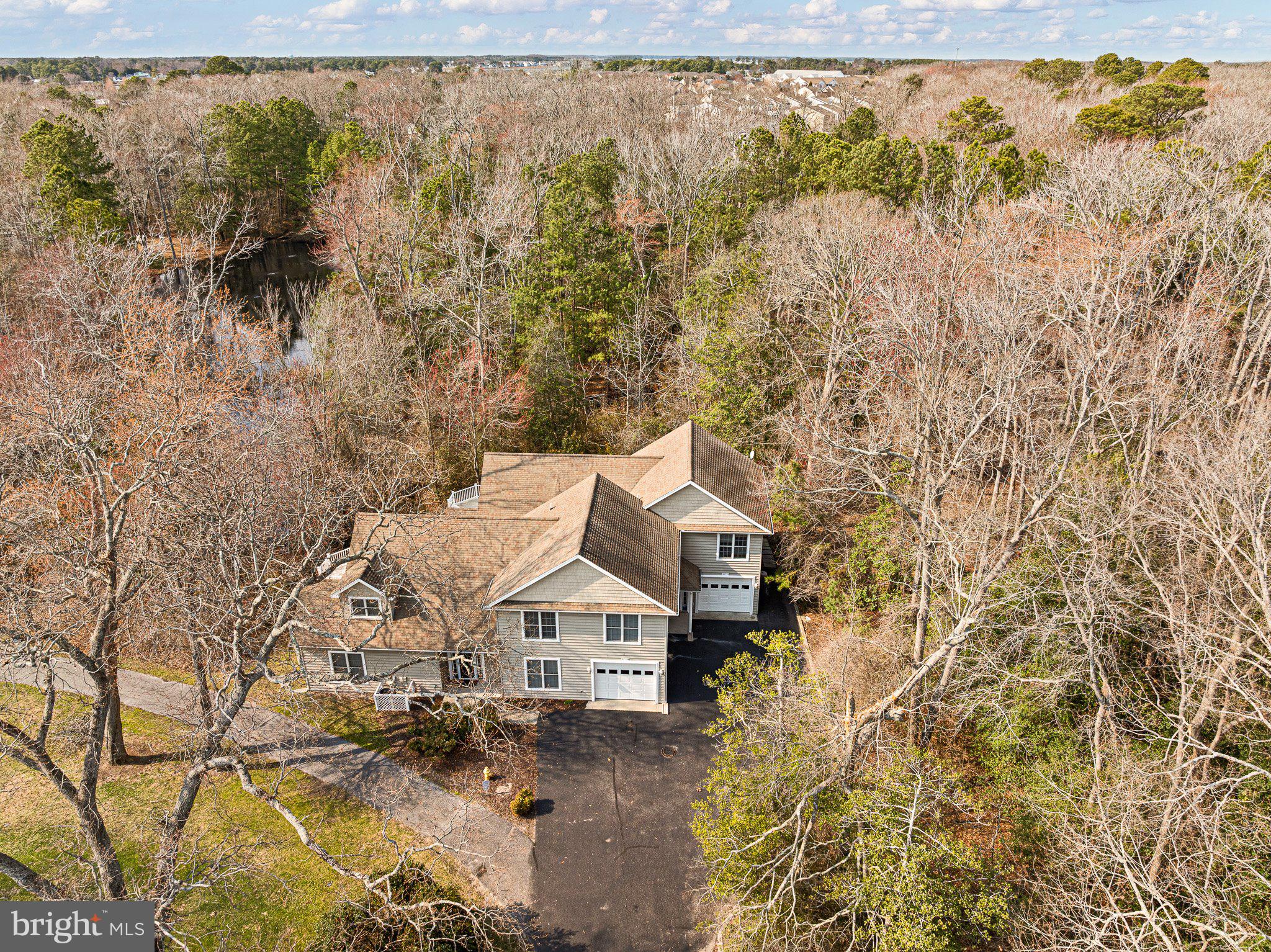 Experience the pinnacle of coastal living in this rarely available Skipjack Village townhouse, perfectly situated just minutes from the sandy shores of Bethany Beach. Nestled amidst the serene conservation lands of Salt Pond, this pristinely maintained 4-bedroom, 3-bathroom home invites you to embrace nature without sacrificing modern comforts.

Step inside to discover an open, airy floor plan that seamlessly connects the kitchen, living, and dining areas—ideal for hosting friends or enjoying quiet evenings at home. A charming 3-season room beckons you to start your mornings with a cup of coffee surrounded by tranquility or unwind in the evenings with the sounds of nature as your backdrop. The spacious primary suite is a true retreat, featuring an ensuite bath and a private balcony where you can soak in picturesque views.

Practicality meets convenience with a one-car garage offering ample storage, as well as an outdoor shower—perfect for rinsing off after a day at the beach.

Beyond the home’s walls, the Salt Pond Community elevates your lifestyle with a wealth of amenities: an executive 18-hole golf course, a recreational center, indoor and outdoor pools, tennis and pickleball courts, a children’s play area, kayaking, and more. Whether you’re strolling along the canal trail, exploring the nearby town park in Ocean View, or enjoying the dining and entertainment of Bethany Beach, you’ll find endless ways to make the most of this idyllic location.

Positioned midway between the vibrant resort towns of Rehoboth Beach, Delaware, and Ocean City, Maryland, this home offers unparalleled access to the best of Delaware’s coastal charm. Whether you’re seeking a full-time residence, a seasonal escape, or a lucrative rental property, this Skipjack Village gem delivers the perfect blend of tranquility and convenience. Don’t miss your chance to make this coastal retreat your own!