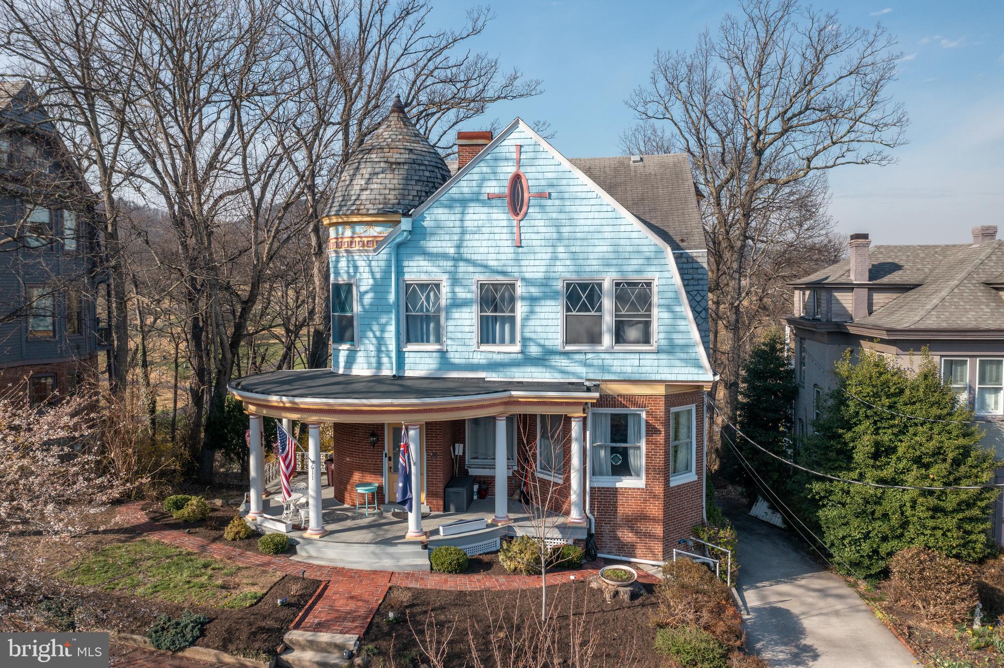 STUNNING VICTORIAN HOME ON HISTORIC WASHINGTON STREET! Welcome to 611 Washington Street, a beautifully restored circa 1901 home offering five bedrooms, 3.5 bathrooms, and three full levels of living space. Located in the historic district, this exceptional home offers breathtaking mountain and city views. From the moment you arrive, the home’s charming curved front porch sets the tone for the character found throughout. Inside, a spacious foyer showcases exquisite woodwork, hardwood floors, and original fireplaces, leading to a formal living room, an elegant dining room, and a library with custom built-in bookcases. The renovated kitchen features stainless steel appliances, a center island, and ample workspace, while a convenient half bath completes the main level. Two staircases lead to the second floor, where you’ll find four bedrooms, two full bathrooms, and a versatile walk-in closet or office space. The fully finished basement offers incredible flexibility with a second kitchen, fifth bedroom, full bathroom, and laundry area. Additional highlights include a walk-up attic, central air, and off-street parking.  All within walking distance to downtown Cumberland and with easy access to I-68!