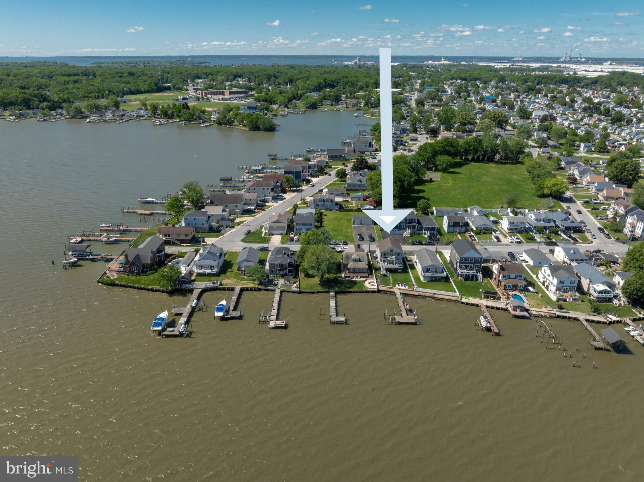**Welcome to 7112 River Drive Road, a meticulously maintained waterfront retreat offering nearly 4,000 square feet of total space and breathtaking panoramic views that take center stage from nearly every room. Combining luxury updates, exceptional boating amenities, and thoughtfully designed indoor and outdoor living spaces, this extraordinary home delivers the ultimate lifestyle.
From the moment you step inside, soaring ceilings, gleaming hardwood floors, and expansive windows draw your attention to the spectacular water views. Natural light fills the home, while the family room offers a cozy gas fireplace and built-in surround sound, creating an inviting setting for both everyday living and entertaining.
The beautifully updated kitchen features Quartz countertops, recessed lighting, abundant cabinetry, an undermount sink, center island with storage, and Samsung Smart appliances installed in 2021, including a tablet-style refrigerator with water dispenser and ice maker. A 2026 kitchen addition created a charming breakfast nook where you can enjoy your morning coffee while taking in the tranquil waterfront scenery. Andersen sliding glass doors with built-in blinds, installed in 2023, open to a maintenance-free walk-down composite deck, seamlessly blending indoor and outdoor living.
The main level also includes two bedrooms, a full bath with porcelain tub from the original home, a laundry room with Smart LG washer, second washer (SideKick), and Smart dryer.
Upstairs, double doors lead to the luxurious primary suite, where oversized windows continue to showcase stunning waterfront views. This spacious retreat offers vaulted ceilings, brand-new carpet, a sitting area, a custom walk-in closet, and a private composite deck overlooking the water. The newly remodeled spa-inspired en-suite bath features a walk-in shower, freestanding soaking tub, double vanity, Smart LED mirror, Bluetooth exhaust fan, and a Smart toilet with bidet, heated seat, and auto-flush functions.
A previously unfinished attic has been transformed into a fourth bedroom/bonus room with new carpet, recessed lighting, updated electrical, built-in storage, and closet.
Outside, boating enthusiasts will appreciate the impressive 80-foot T-pier with water, electric, 30-amp shore power, two boat lifts (12,500 lb. w/Gem remote and 3,500 lb.), and a 1,500 lb. jet ski lift. 3 ft MLW and a hard sandy bottom, this property is ideal for boating, fishing, and water recreation. On clear days, the sellers note you can see the Eastern Shore from the end of the pier.
Additional features include concrete bulkhead, under-deck drainage, two sheds with maintenance-free platforms, a Polywood swing overlooking the water, a two-car attached garage, tankless gas water heater, Nest thermostat, generator hookup, fresh interior paint (2023), sealed driveway (2024), new shutters, front door, chandeliers, Hunter ceiling fans, and updated exterior lighting. The pier was redecked in 2020 with new end caps and hurricane straps added in 2024.
Flood insurance is only $565 annually. 
This exceptional property offers easy access to waterfront dining, fishing, and endless boating adventures. Experience the unmatched beauty of waterfront living and schedule your private tour today.
