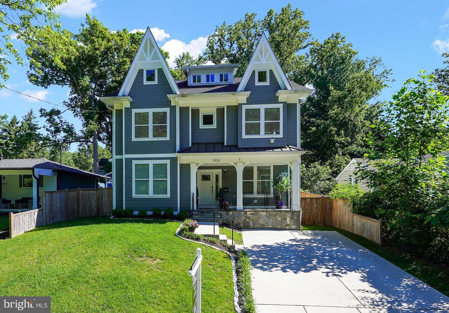HUGE PRICE ADJUSTMENT -- Fabulous new price! This light-filled, generous home with subtle Victorian touches is so beautifully detailed and is wonderfully located in walkable and charming Kensington! Rebuilt in 2022 and offering almost 3,800 sq ft of beautifully designed and appointed living space, this home blends luxury, comfort, and flexibility—truly a place with room to grow. The welcoming, covered front porch sets the tone inviting you inside, where you’ll find 5 generously-sized bedrooms—each with its own private, attached bath—plus a convenient half bath on the main level and a first-floor bedroom ideal for guests or multigenerational living. The gourmet kitchen is a true gathering space with a tremendous island – great for entertaining and seating, separate wall oven and gas cooktop, and an open flow to the living room featuring a gas fireplace flanked by custom built-ins. High ceilings, abundant windows, and hardwood floors on the main level create a bright, airy feel throughout. The dining room’s bay window adds classic charm, while French doors lead to a private, fenced backyard with a storage shed. Upstairs, the spacious primary suite impresses with a tray ceiling, freestanding soaking tub, double sinks, and two closets, plus there’s an open office on the second floor (which could alternately be utilized for additional primary closet space). The third level, boasting the 5th en suite, also offers a large family room—perfect for movie nights, play space or homework stations, and is tucked away from high-traffic areas. Additional highlights: Dual-zone HVAC, spacious driveway for off-street parking, custom tile work in the bathrooms and beautiful trim and millwork throughout. Enjoy Kensington’s small-town charm with big-city access—walk to community events, and locally owned shops and restaurants along with the trails, paths, ballfields and courts of Rock Creek Park. Less than one mile to the MARC train with easy access to Union Station and downtown DC.