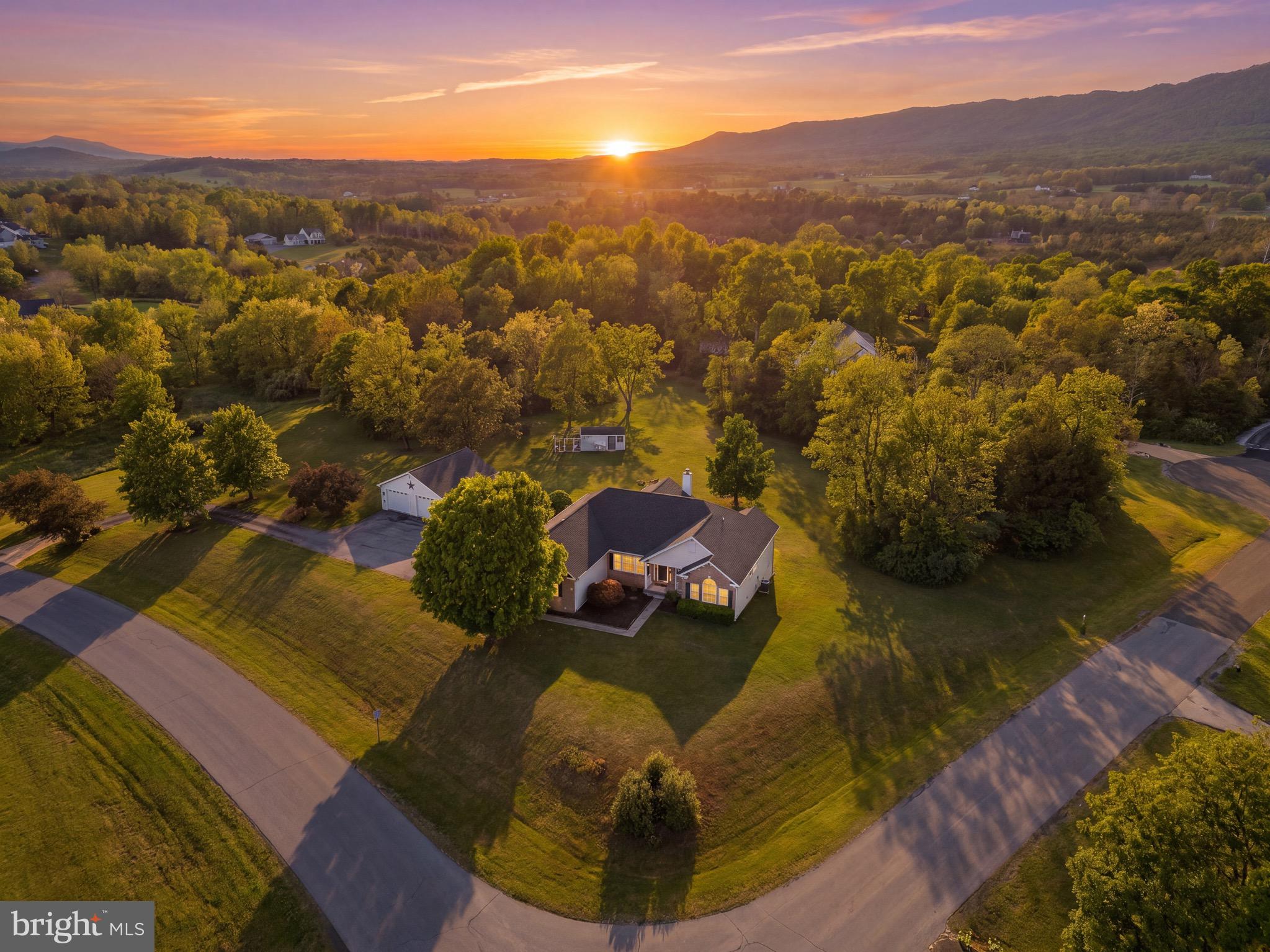 An updated ranch on land with a partially finished basement and a 2-car detached garage! All of what you've been looking for...Freshly updated from top to bottom, 30 Savannah Drive offers the kind of full-house renovation you will love, paired with gorgeous mountain views & a flexible & functional layout. Major updates include a new roof just 2 years ago, refinished hardwood floors, fresh paint throughout, a beautifully redone kitchen with gorgeous counter tops & layout, & all 4 bathrooms renovated with modern finishes. A wood-burning fireplace adds warmth and charm to the main living space, while the partially finished basement expands the home’s versatility with 2 additional bedrooms/offices and a full bathroom—perfect for guests, work-from-home space, hobbies, or extended living needs. There are 4 bedrooms on the main level with a powder room on one side of the house and a full bath on the other side of the house. The primary en suite has dual closets, fresh hardwoods, and a redesigned en suite bathroom.  While the house has a 2 car garage attached, there is an additional 2 bay detached garage perfect for extra hobbies, lawn gear, and storage, etc. This move-in ready home blends comfort, updates, and everyday functionality. So close to all that the Shenandoah Valley has to offer.
