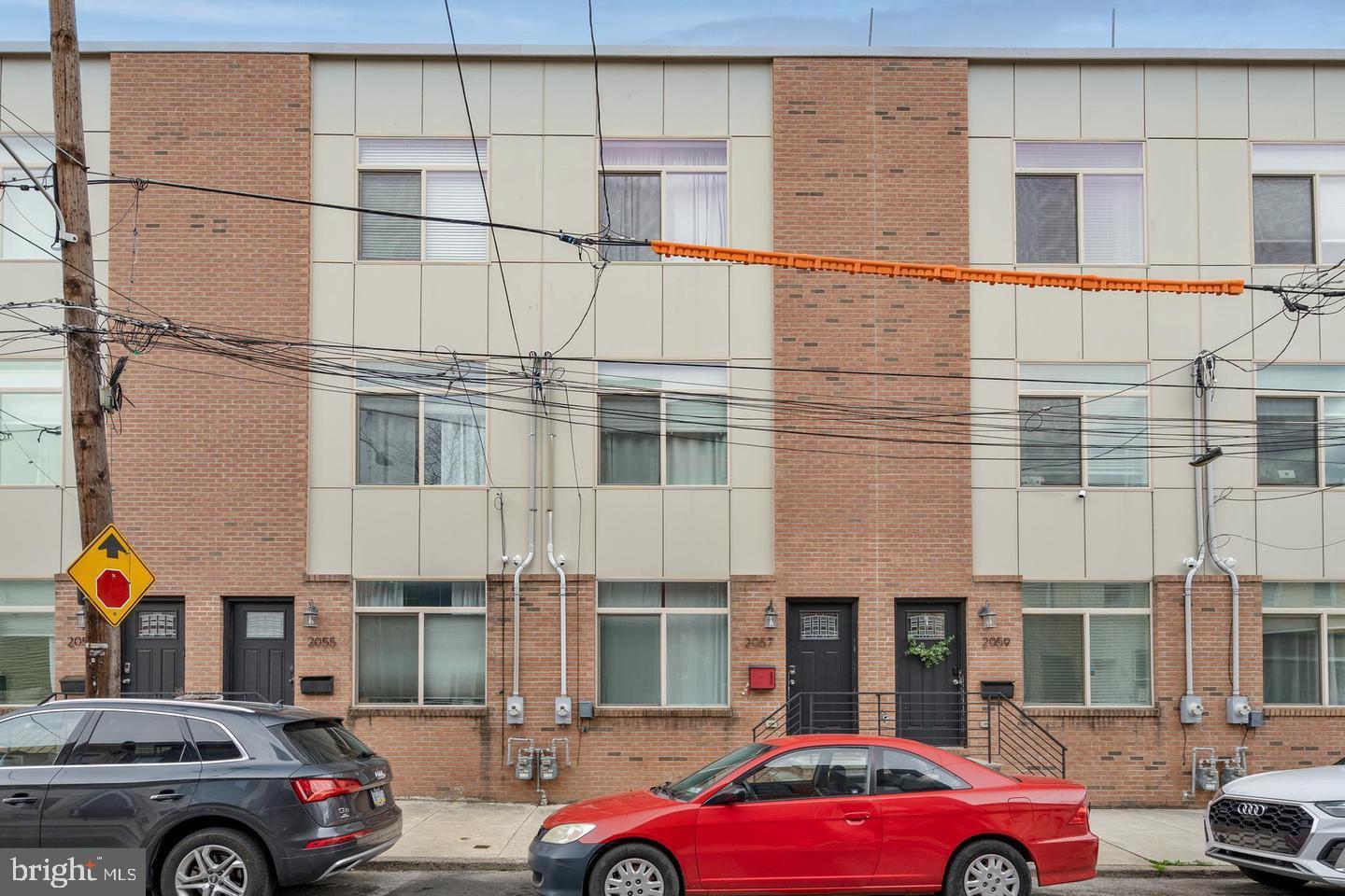 Welcome to 2057 E Letterly! This spacious, 3 bedroom, 2.5 bath townhome in East Kensington was built in 2017 and has roughly 2 years of tax abatement remaining. Step inside to discover a thoughtfully designed open layout on the first floor boasting a designer kitchen with granite countertops and large island. The second floor features a full laundry room, full bath, two spacious bedrooms, and ample closet space. The luxurious primary suite awaits you on the third floor. The primary bath includes a soaking tub, oversized shower, and double vanity. The expansive bedroom includes a huge walk-in closet. Need more space? The finished basement offers versatility, serving as a fourth bedroom and powder room, with additional storage space for your convenience. Experience views of Philadelphia from the roof deck, perfect for entertaining. Two HVAC systems ensure customized comfort throughout the year, while hardwood and tile floors, 9' ceilings, and recessed LED lighting add to the home's appeal. Schedule your tour today!