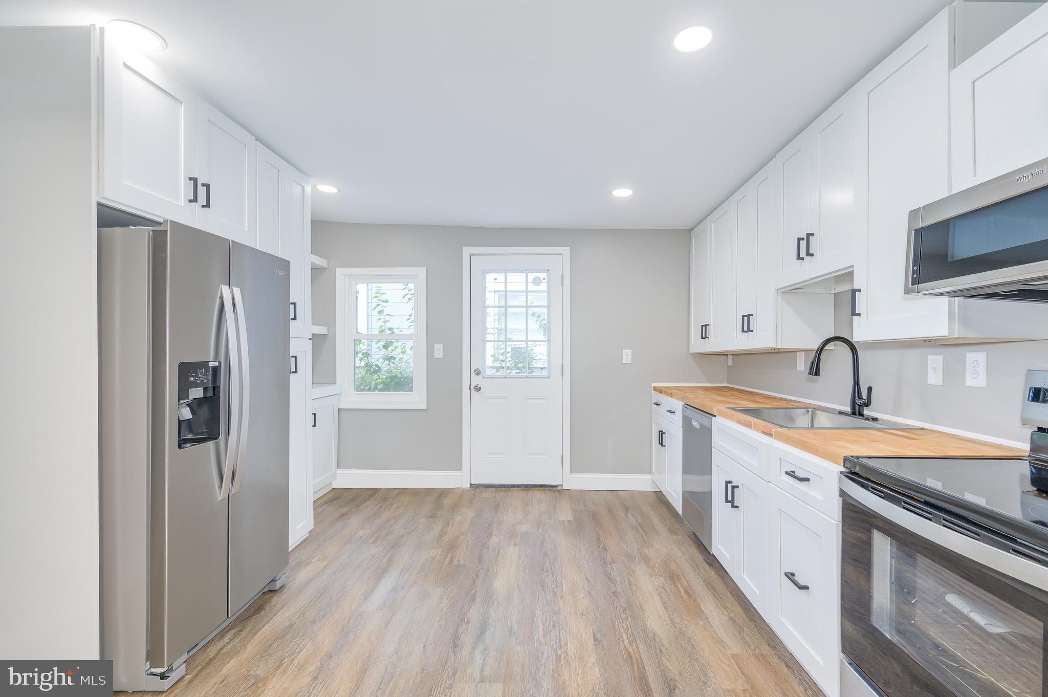 Beautifully remodeled in 2025, this charming home at 211 E Liberty Street, Martinsburg, WV blends classic character with modern updates. Featuring 3 bedrooms and 1.5 baths, this home offers a brand new roof, windows, siding, HVAC, and updated electrical, and plumbing. The updated kitchen showcases butcher block countertops and stainless steel appliances, while LVP flooring flows seamlessly throughout. Enjoy the inviting backyard, perfect for relaxing or entertaining. A move-in ready gem with timeless appeal and thoughtful updates!