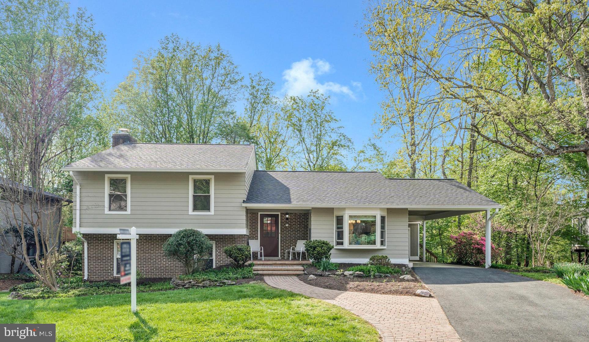 Don't miss this lovely home nestled deep into a highly desirable neighborhood in NE Vienna. You can move right in and live amongst the tree tops on a rarely available, .29 acre lot, backing to acres of gorgeous parkland. Steps to the trail leading to the W&OD Trail and the Town of Vienna shops and restaurants, beautiful historic Church Street in downtown Vienna, Glyndon Park and more. Wolftrap Elementary, Kilmer Middle and James Madison High School! You really can have it all with this four bedroom, three full bathroom home loaded with charm and character.  Well maintained home with exceptional natural light and stunning views from the living and dining rooms, patio and the expansive deck.  Close to Metro/Tysons/Reston/DC/ and Wolf Trap Performing Arts Center! Hardwood floors on main level and stairs.  The remodeled kitchen has a large center island, stainless steel appliances, an abundance of cabinetry, recessed lighting, granite countertops and is the heart of this home. Living room and Dining room have access to two sliding glass doors leading to a large composite deck with STUNNING views of mature trees and acres of parkland, perfect for relaxing or entertaining.  The transition from the interior of the home to the exterior is nothing short of rare and oh so special. The upper level has a sizable Primary bedroom suite with an en-suite bathroom, two additional bedrooms and a full hall bathroom. New carpet installed in all four bedrooms and landing. Fresh interior paint throughout. The lower, walk out level has an oversized fourth bedroom, a Family room with a wood stove, a laundry room and a third full bathroom. The Family room has built in shelving and a sliding glass door with access to a patio with stairs leading up to the deck. The floorplan and flow of this home is wonderful. Kitchen door allows for access from kitchen to carport and shed with steps leading to the deck. YOU WILL LOVE IT HERE! Very private, quiet living opportunity. Charming curb appeal, just a few homes away from a Cul de sac location, walkable to Wolf Trap ES. Tysons Corner /495/66/ and Toll Road are all 3-3.5 miles away. Some of the many upgrades: New roof (2021), James HardiePlank siding (2021), Heat Pump (2022), Hot Water Heater (2022), ProVia Bay Window and secondary window in kitchen (2021), front walkway (2021), range and microwave (2025), refrigerator (2022), new electrical junction box  and EV Charging Station (2023), whole house surge protector, JES crawl space encapsulation with dehumidifier (2021) and so much more!! Hurry, don't miss this one! Open House Saturday April 26, 2-4 and Sunday April 27, 1-4PM