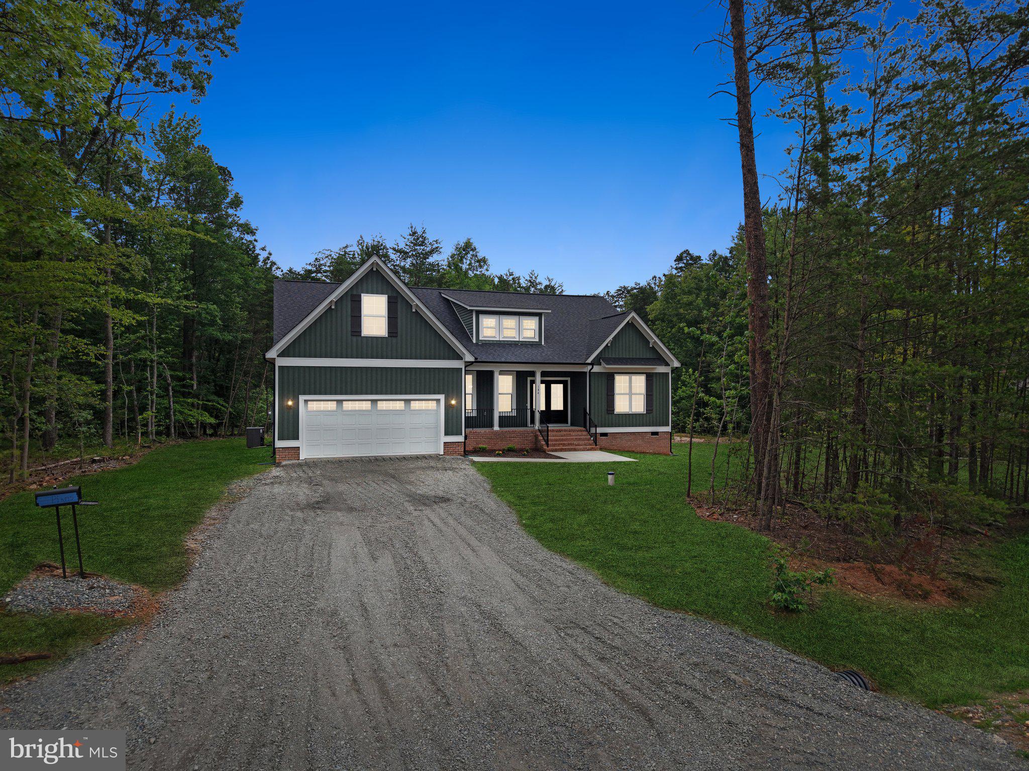 Welcome home to Freshwater Estates, where modern craftsmanship meets the relaxed lifestyle of Lake Anna. This beautifully designed Bancroft offers over 2,600 square feet of thoughtfully planned living space, featuring 3 bedrooms, 2.5 baths, a spacious bonus room, and a two car garage, all nestled on a private wooded homesite.

From the moment you arrive, the home's inviting open concept design is filled with natural light and offers an effortless flow between the gourmet kitchen, dining area, and expansive family room with an electric fireplace creating the perfect space for entertaining or everyday living. The kitchen features a large center island, built-in wall oven and microwave, a cooktop, abundant cabinetry, and quality finishes throughout.

The main level primary suite provides a peaceful retreat with a spacious walk-in closet, and a luxurious bath complete with dual vanities, a soaking tub, and a beautifully tiled walk-in shower. Upstairs, the finished bonus room offers endless flexibility as a home office, media room, guest suite, or playroom.

Step outside to the oversized rear deck overlooking the private wooded backyard, where you'll enjoy peaceful mornings, outdoor entertaining, and the beauty of nature year round.

What truly sets this home apart is the opportunity to enjoy Lake Anna without the premium price of waterfront ownership. Your assigned boat slip (#58) is included, along with access to the community boat launch and waterfront common area, making it easy to spend your days boating, fishing, paddleboarding, kayaking, or cruising one of Virginia's premier recreational lakes.

Whether you're searching for your primary residence or the perfect weekend escape, this exceptional new construction home offers quality, comfort, and the lifestyle you've been waiting for.