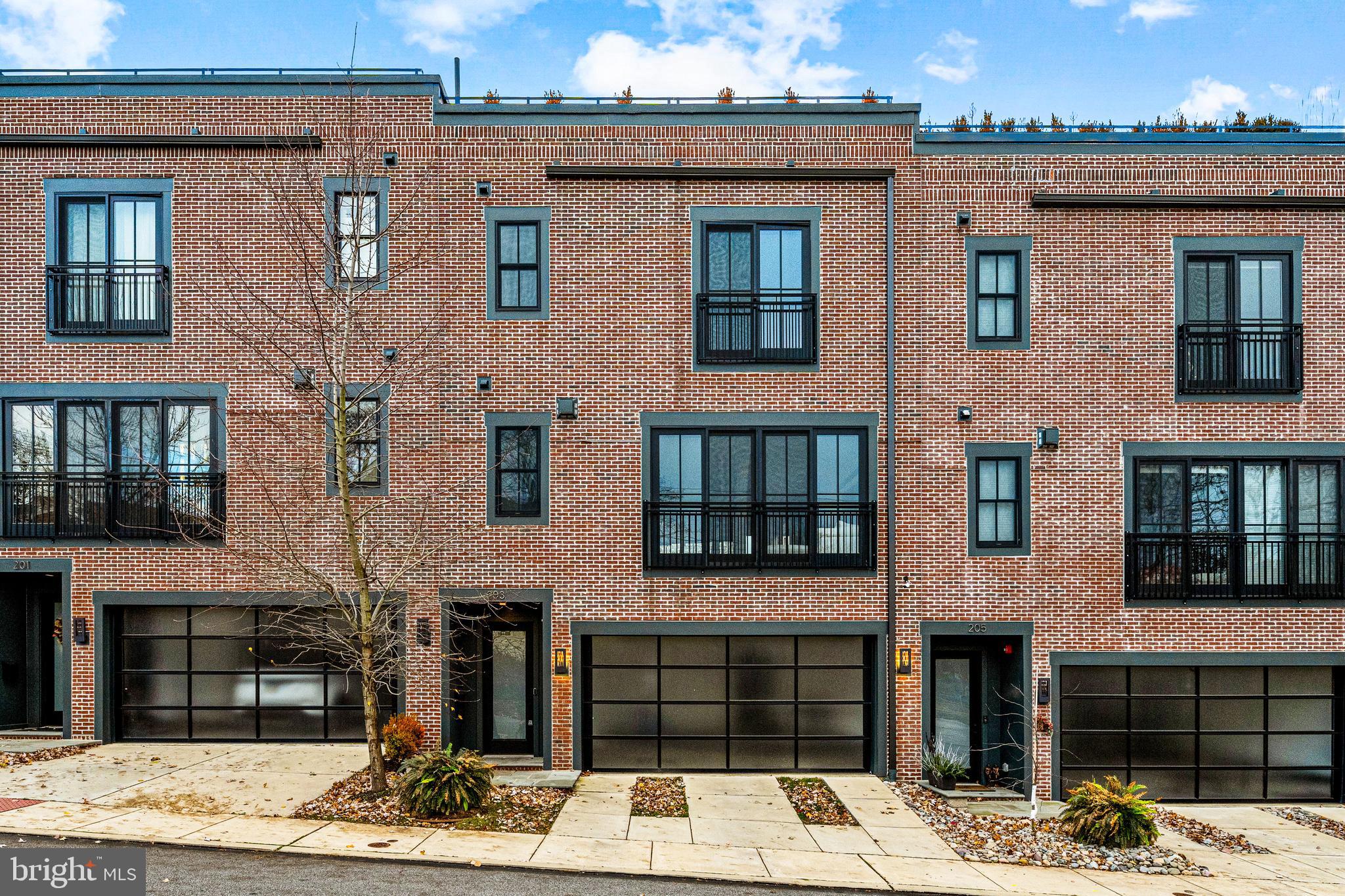 Look no further and move right into this fabulous, sun-filled residence in the center of Downtown Wayne. Incredible industrial chic design elements and timeless modern materials are showcased throughout by renowned builder Weiss and Associates. Endless features include bright freshly painted neutral decor,  soaring ceilings, open staircases,  exposed brick walls, large warehouse-style windows, a wonderful open floor plan, breathtaking chef's kitchen with Thermador and glass Subzero appliances, AGA range hood, generous pantry with custom shelving, wet bar with smoked glass leathered quartzite countertops, gas fireplace in the great room, primary bedroom suite with 2 customized walk-in closets, 2 additional spacious bedroom suites, with customized walk-in closets,  incredible private roof top deck offering relaxing outdoor living space with beach house-worthy wood flooring and gas firepit and elevator-ready shaft space. Tucked back off of the main commuting arteries, this one of a kind home is just blocks from renowned schools, shopping, trains, a plentitude of wonderful restaurants, recreational facilities, clubs and more!