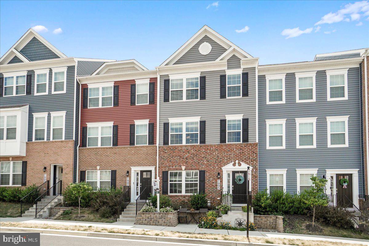 Discover modern comfort and convenience in this charming 3-bedroom, 2.5-bathroom townhouse located in a vibrant community. Built just three years ago, the home features NEW hardwood flooring on the stairs and LVP flooring throughout, including  the upstairs hallway (which had been carpet).  The kitchen shines with abundant natural light, stainless steel appliances, and an oversized island perfect for both meal preparation and casual dining. The interior of the home has been recently painted, including ceilings, doors, and trim. Outside, a small front patio and back deck offer cozy retreats for enjoying fresh air and relaxation. Residents enjoy access to community amenities such as a pool and clubhouse, while proximity to shopping, parks, and commuter roads ensures convenience for everyday living. While this home is relatively new, you'll see when you take a tour that it stands out from other models in the neighborhood! Don't miss the opportunity to make this stylish townhouse your new home in this sought-after neighborhood.