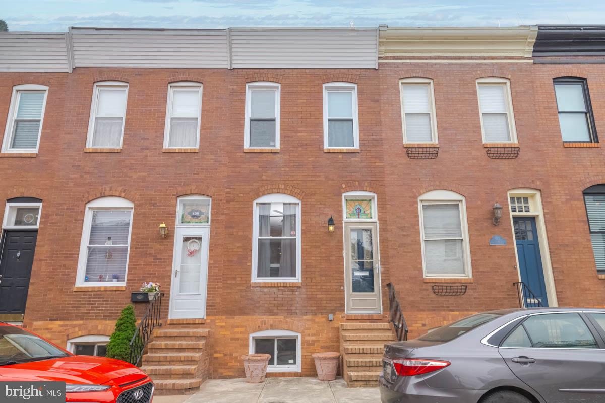 Welcome to 611 S. Robinson Street – where charm meets convenience in the heart of Canton! This affordable and well-maintained rowhome places you just steps from all of the neighborhood’s most popular attractions, including vibrant dining, shopping, and waterfront hot spots. Step inside to an inviting open-concept main level featuring hardwood floors, exposed brick, and a beautifully preserved stained-glass transom window—blending classic Baltimore character with modern comfort. The spacious living and dining areas are perfect for entertaining, while the kitchen offers ample cabinet space, modern appliances, and room for a cozy breakfast nook. Just off the kitchen, the private rear patio is ideal for summer BBQs, outdoor dining, or relaxing with your morning coffee. Upstairs, you’ll find two comfortable bedrooms and a beautifully updated full bath with a deluxe finish. The unfinished lower level provides plenty of storage, laundry space, and tons of potential—create a home office, gym, or bonus living area to fit your lifestyle. Enjoy plentiful street parking and a prime location close to Johns Hopkins, Canton Crossing, Brewers Hill, Fells Point, Harbor East, and O’Donnell Square. With easy access to I-95 and I-895, commuting to DC, Philly, or even NYC is a breeze. Why rent when you can own for less? Schedule your showing today and make this charming Canton home yours!