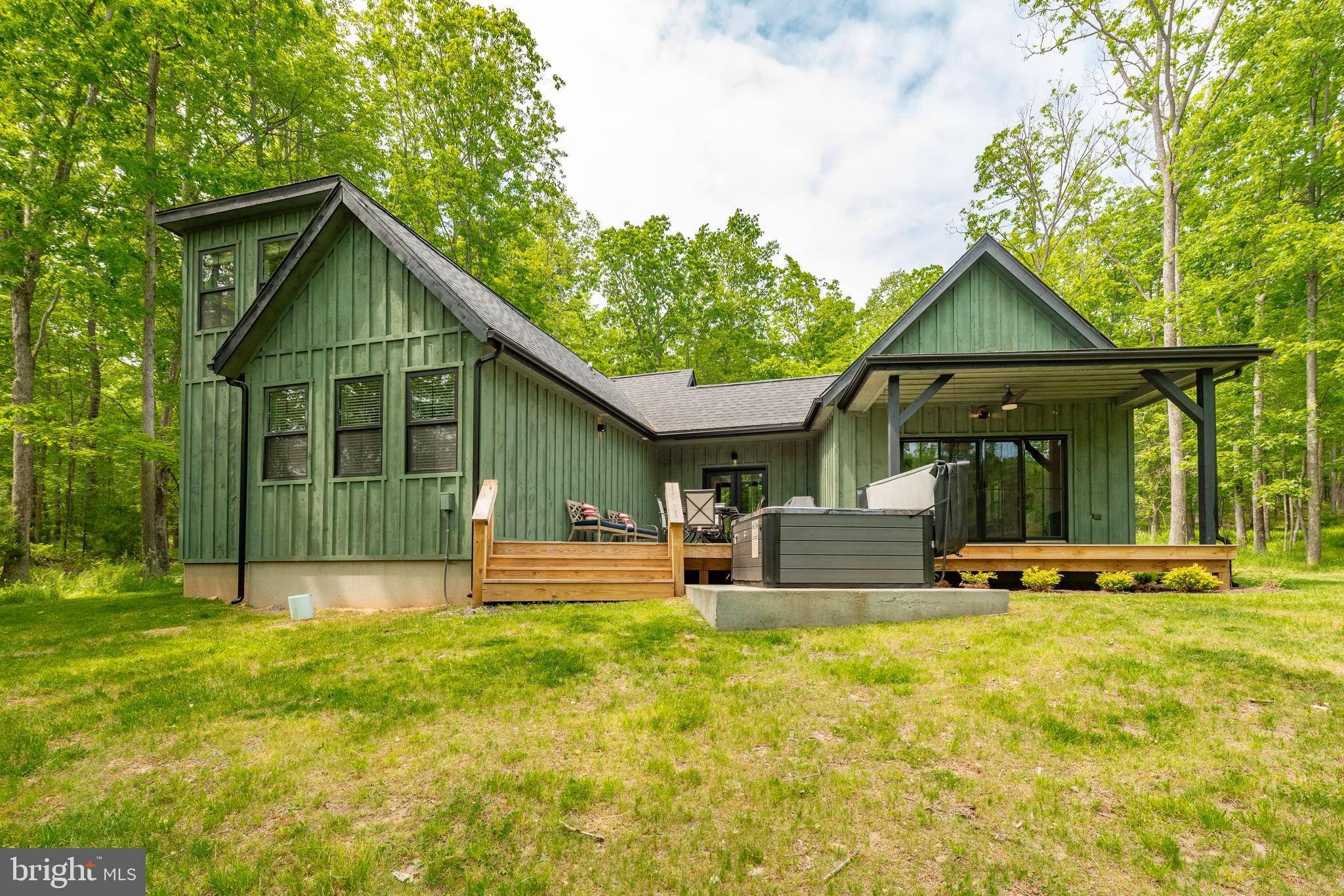 Welcome to Morning Light, a beautifully appointed 3-bedroom, 2-bath mountain retreat located in the prestigious Thousand Acres community at Deep Creek Lake. Perfectly positioned along Hole #3 of the Thousand Acres Golf Course, this home offers peaceful golf course views, quality finishes, and a thoughtfully designed open floor plan that's ideal for entertaining or relaxing. Interior highlights include a stunning stone fireplace, spacious kitchen and living area, loft, private primary suite, and a sauna for year-round enjoyment. Outside, unwind on the expansive deck, gather around the outdoor fire pit, or soak in the hot tub after a day of adventure. Conveniently located just minutes from Deep Creek Lake, Deep Creek Lake State Park, restaurants, marinas, and other area attractions, this property offers the perfect blend of privacy, comfort, and easy access to everything the lake has to offer. Whether you're searching for a full-time residence, vacation getaway, or investment opportunity, this exceptional home is ready to impress!
