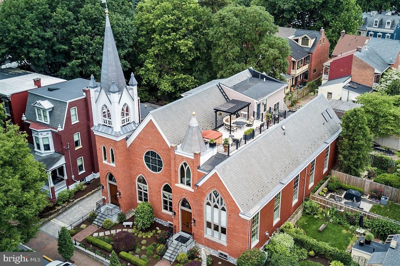 Come live in this one of a kind home located on a quaint tree-lined block of the Chestnut Hill neighborhood in Lancaster City. You MUST SEE this property to appreciate the level of quality craftsmanship. This completely renovated home is simply stunning. Enjoy the restored stain glass windows, original cathedral ceilings, and custom architectural woodwork. Sit atop your private rooftop terrace and enjoy sweeping views of the city. All new state of the art systems makes for economical living in this historic conversion of an 1890's building. The first floor has an open floor plan that is perfect for entertaining. The second floor has a great loft with built-in cabinets and a gas fireplace and a Large Master bedroom suite with a bay window, master bath with custom cabinetry and walk-in shower. His and her walk-in closets with built-ins for great organization. 3rd floor consists of 2 additional bedrooms with full bath and den/office area overlooking 1st and 2nd floor with access to the rooftop terrace. Fully finished lower level with ceramic flooring, exposed stone walls and full bath lends itself to great entertaining space.  Don't miss this opportunity for unique city living.  Walking distance to downtown and Central Market.  Call today for your private showing. Taxes are calculated off of new assessment.