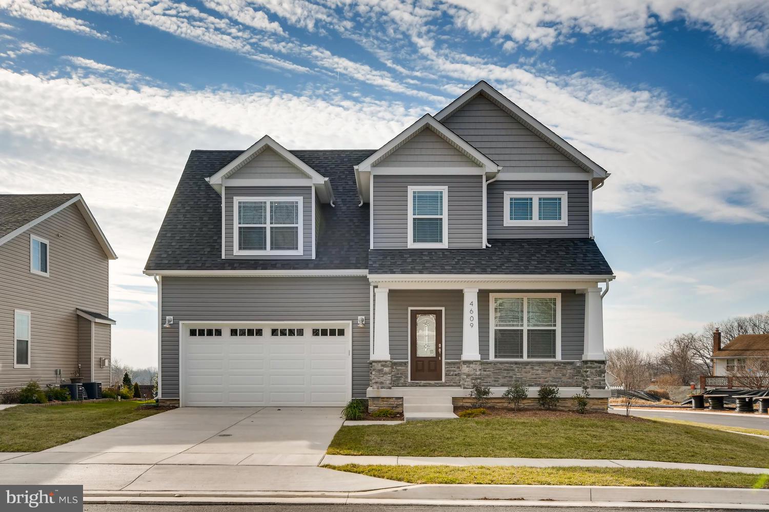 New Home just completed: Custom Gourmet Kitchen w/farm sink.  Hardwood floors on the main level. Whirlpool Stainless Steel Appliances.  Finished Lower Level with Bar, Electric Fireplace and Fifth Bedroom with a Full Bath. Spa style Master Bathroom. LED Lighting Package.  Optional Deck.MOVE IN TOMORROW!!!