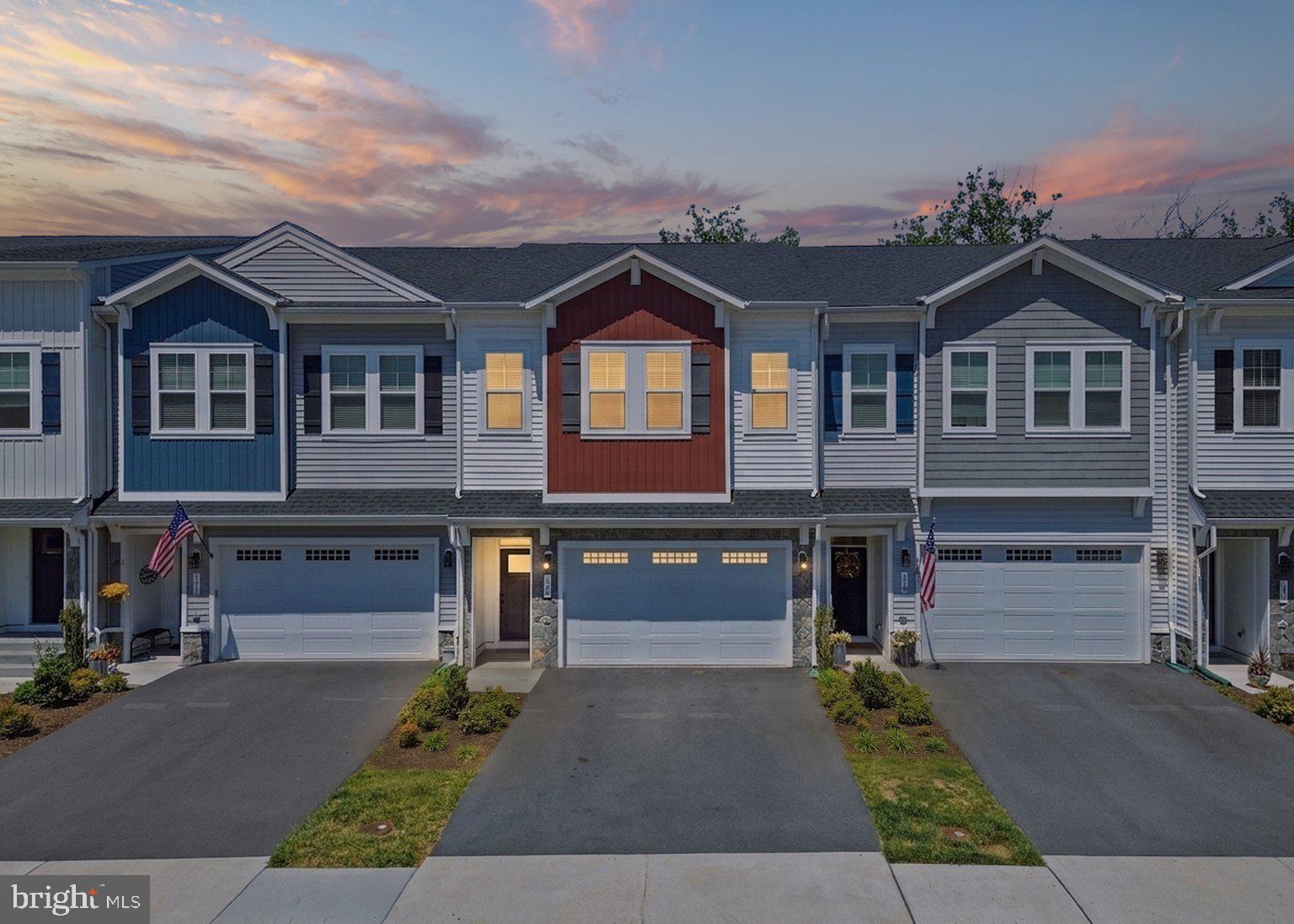 Stunning 2 car garage Van Metre built town home available now in Lake Frederick! This beautiful 3 level residence which was delivered in 2023 spans over 3000 square feet and features high ceilings, wide hallways and all the structural upgrades offered by the builder. Just a few of the interior highlights include warm luxury vinyl plank flooring spanning the entire main level and upper hallway with oak staircases connecting the levels. In the kitchen you will find contemporary white cabinetry with complimentary backsplash and under cabinet lighting, premium appliances, oversized sink and quartz counters. Upper level features an expansive owners suite with tray ceiling and spacious closet. Unwind in your owners bath outfitted with dual vanity, quartz counters, shower with dramatic floor to ceiling tile and frameless glass door. Two additional guest beds both with recessed lighting, shared bath and laundry room finish off the upper level. Fully finished walkout lower level includes a large recreation room, a true fourth bedroom and full bath. All this situated on a premium lot with wooded views that can be taken in while entertaining family and friends on the composite deck. Amenity rich neighborhood includes lake access, walking trails, clubhouse with fitness center, community pool, lawn maintenance and more. Don't feel like cooking at home tonight? You are in luck because there is a fantastic full service restaurant located in the neighborhood! With all this being offered at such an incredible value this home will not last long. Schedule your showing today.