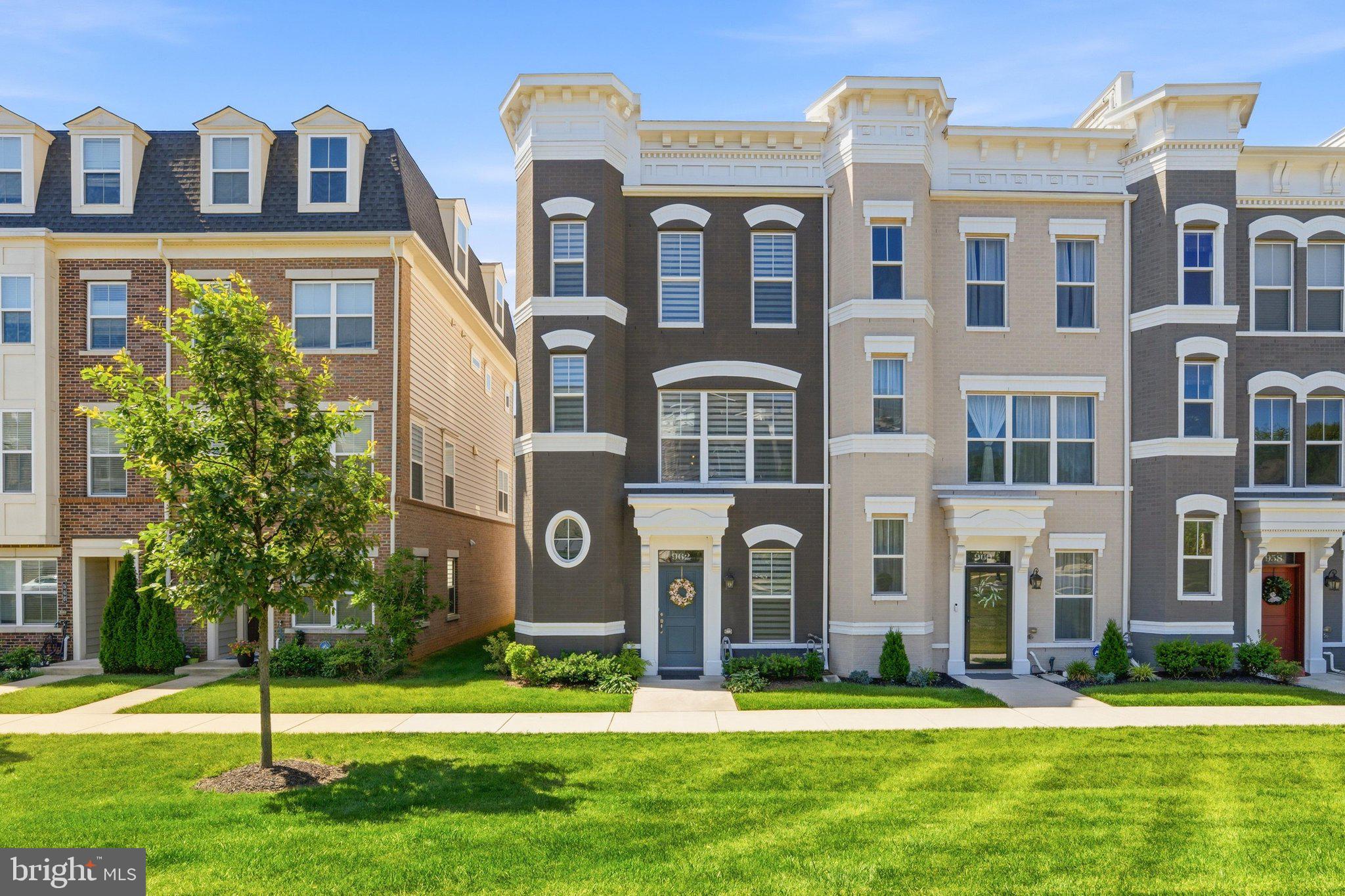 Welcome to the crown jewel of Eastchurch. A Wormald built four-level townhome reimagined with a level of luxury and custom detail that simply does not exist anywhere else in the neighborhood. This is not just a home; it is a statement. The experience begins on the first-floor walk-in level, welcoming you with an entry lounge anchored by stunning, custom built-in shelving, a private bedroom with a full bath, and seamless access to the rear garage - complete with a sleek epoxy floor finish. The entry level bedroom has custom built ins and can function as a guest suite or a private home office. Ascend to the main living level, where the heart of the home has been elevated to an entertainer's dream. A true gourmet chef's kitchen features top-tier stainless steel appliances, a premium gas stove, and an expansive open layout that flows effortlessly into the dining and living spaces. The seller has enhanced an already luxury feel with a floating shelf bar, custom designer lighting in the dining room and kitchen, elevated light fixtures, and the unique distinction of brick walls in both the dining and living rooms — a rare architectural character that sets this home apart. Detailed built-ins flanking the gas fireplace — designed by local favorite, Weathered Wood Worx — complete the elevated aesthetic. Step outside to a private, main-level deck, creating a flawless indoor-outdoor transition for hosting. The main level is rounded out by a powder room and modified pantry. The third level is a sanctuary of rest, hosting a spacious primary suite with a spa-inspired ensuite bath and custom designer lighting, all enhanced by custom cabinets in the primary closet and a detailed wood accent wall behind the bed. The bedroom level features soaring ceilings, a generous second bedroom, an additional full bath, and a conveniently located laundry room. Throughout all four levels, a whole-home central vacuum system adds an effortless touch of everyday luxury rarely found in townhome living. The true showstopper - and the ultimate differentiator - is the breathtaking fourth-floor retreat. Unrivaled in the community, this penthouse-level entertainer's dream boasts a sleek, custom built-in wet bar, an expansive lounge, a half bath, and access to a massive private sky deck offering sweeping views and quiet elegance. Set within the vibrant Eastchurch community, you'll enjoy manicured walking paths, a playground, and a premier clubhouse with an outdoor pool. This unbeatable location places you minutes from Monocacy Village Park, Carroll Creek, and the MARC Station, with the upscale craft breweries, award-winning restaurants, and boutique shopping of Downtown Frederick right at your doorstep. Unmatched, unrepeatable, and utterly luxurious -- this is the one you wait for.