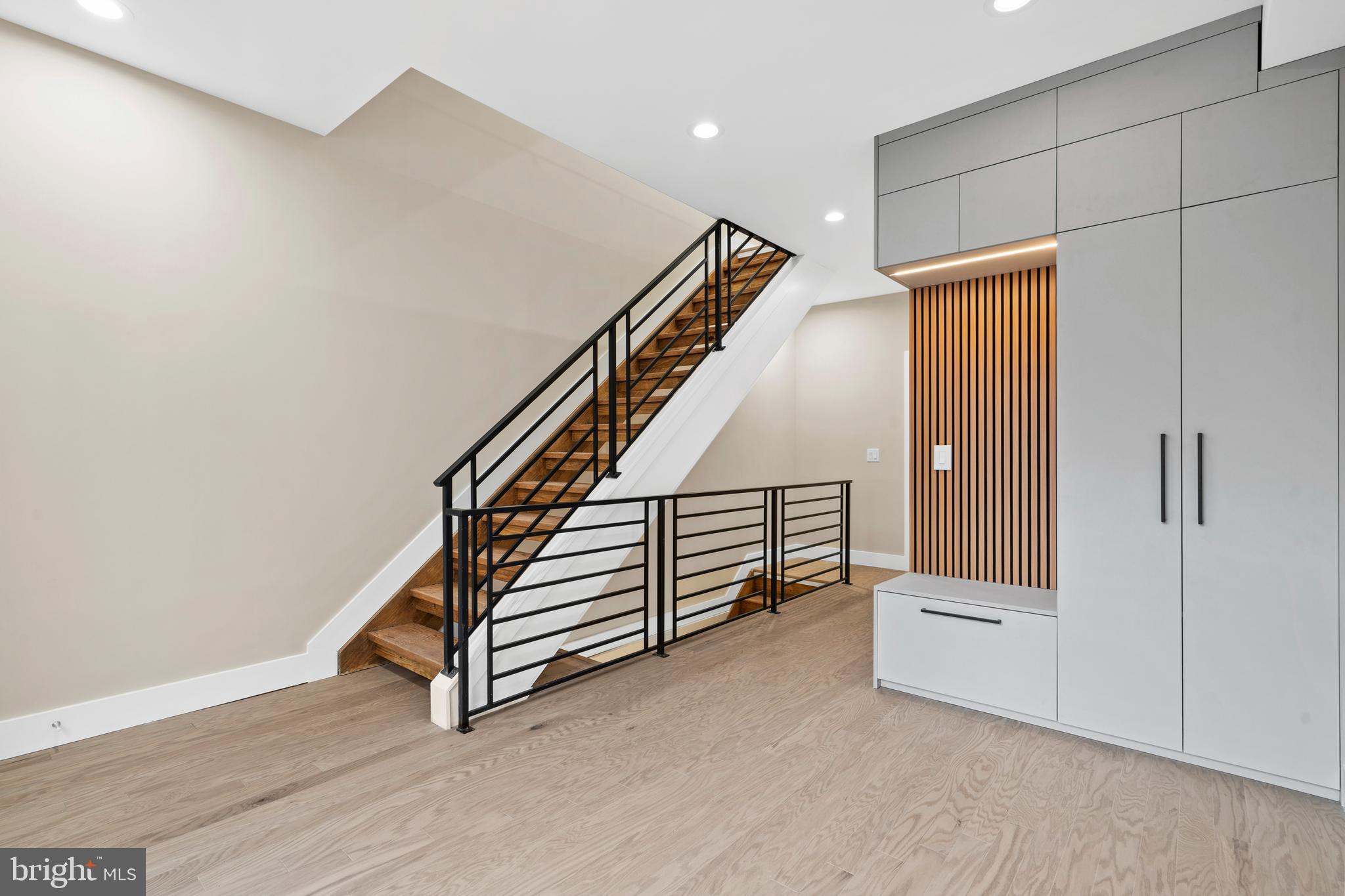 Welcome to 1031 S Fairhill Street, a stunning 3-story new construction with an **Estimated $80,000 tax savings over the course of the rarely offered FULL 10 year tax abatement** in Queen Village offering thoughtfully designed living space. With sophisticated finishes, a rare community garden view, and modern smart-home features, this residence perfectly balances comfort and style. The lower level features a versatile bedroom with a full bathroom, ideal as a private suite, home office, or media room. The first level greets you with a flexible entry space, leading to the second bedroom with its own bathroom dividing the two spaces that can adapt to your lifestyle needs. The second level is the heart of the home - an airy open-concept floor with living, dining, and kitchen seamlessly flowing together. Anchored by floor-to-ceiling windows and east-west exposure, natural light fills every corner. The chef’s kitchen with granite countertops, premium appliances, and sleek cabinetry sits alongside the dining area framed by a bay window overlooking a city garden. This unique vantage point brings in rare greenery and a sense of openness seldom found in city living. The third level is reserved for the primary suite, featuring a spa-like bathroom with heated floors, a walk-in closet with custom built-ins, and a private balcony with serene city views. Enjoy multiple outdoor escapes, from the concrete-paved backyard with street easement access to the expansive rooftop decks panoramic skyline views - perfect for entertaining or relaxing at sunset. This home is also enhanced with integrated smart-home technology, including security cameras, locks, and thermostats that can all be controlled with a swipe of your finger. Don't forget about the gas heating, a gas dryer, tall ceilings, and engineered hardwood floors, and this home truly checks every box. The home is being finished and will be substantially completed prior to settlement offering the opportunity for a buyer make modifications to the kitchen, countertop colors, flooring, tile work, hardware color and more!