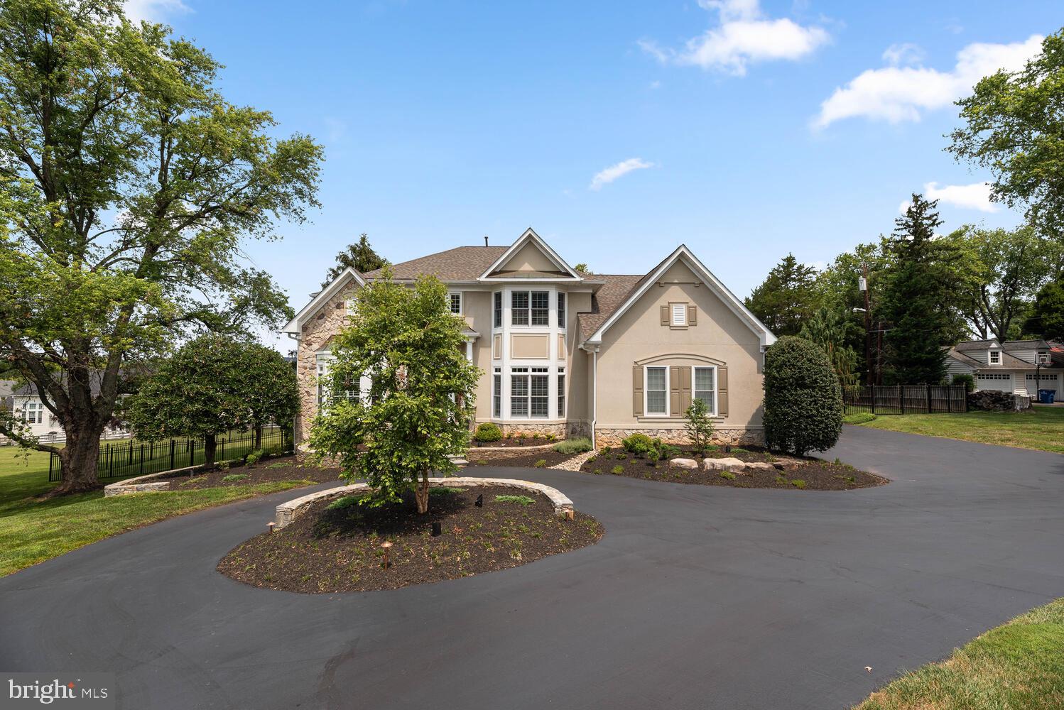 Welcome to this STUNNING John Laing custom built home, in the sought after community of Potomac Glen Estates. From the elegant grand foyer, to the gorgeous backyard, and FOUR car garage, you will love all this home has to offer.  Not one detail has been spared, and pride of home ownership is abundant. Boasting 6 bedrooms, 5 1/2 baths and over 7,300 square feet, there is no shortage on space for family or entertaining.

As you enter the two-story foyer with gorgeous columns separating the space, you will be delighted with the expansive, yet functional first floor layout. Amazing home office space with built-in cabinets, glass pocket doors, lighted vaulted barrel ceiling; Living Room with gas fireplace with a beautiful custom mantle; Large dining room with tray ceiling and indirect lighting; Kitchen is completed with Maple cabinetry, Sub-Zero Refrigerator, granite countertops, ceramic floor with marble insets, large island with downdraft cooktop & sink, and two desks with undercabinet lighting; There is an additional sitting area with see-thru glass fireplace, and a large breakfast room overlooking the backyard; Large LOW MAINTENANCE DECK off the kitchen; Family Room incudes custom paneling & built-ins, coffered ceiling, surround sound, see-thru fireplace, and woven wood shades complete the room; Butler's Pantry with large countertop and cabinets; FIRST FLOOR BEDROOM W/ EN SUITE BATH and private French door leading to the deck; Mud Room has another refrigerator & freezer, as well as a large utility sink, countertop & storage cabinets; Lovely plantation shutters, recessed lighting & beautiful hardwood floors completes all of the main level.

As you move upstairs, you have the HUGE primary bedroom (approx 14'X16') & sitting room (approx 9'X12'), including TWO walk-in closets, tray ceiling with indirect lighting, patio door to private master bedroom deck & plantation shutters; Primary bath has Maple cabinets, ceramic tile with glass inserts, large shower with bench, Kohler corner tub with jets, linen closet & plantation shutters;  Second large bedroom with en suite bathroom, walk-in closet & plantation shutters; Third and fourth large bedrooms both include a dedicated sink with a "Jack and Jill" shared shower and commode, plantation shutters & walk in closets in both rooms as well; Upstairs Laundry Room has pedestal front load washer & dryer, ceramic tile floor, and cabinets and garment rack.

And, it just keeps going... The walk-out level basement space includes the 6th bedroom & 5th full bathroom; Game Room with built-in cabinets, speaker system, and WET BAR with stainless refrigerator/freezer and large walk-in storage closet behind bar; Card Table Room with speakers & ceiling fan; Large Exercise Room; Utility Room & Two additional storage closets.

Car enthusiast? FOUR CAR GARAGE! Currently set up with the 4th garage as a fully climate-controlled garage/shop with storage cabinets. Remote Wi-Fi access to 2-car garage door; shelving & cabinets in garages; Garage electric raise/lower bike & storage rack. Incredible backyard has a beautiful patio with built-in bench, fenced in yard, landscape lighting front & back, and dramatic circular driveway.

Honorable mentions include 10' ceilings main level, 9' upstairs & basement; THREE zone HVAC systems; Upgraded Electrical system; Dedicated Gas line for grill on the deck; TWO 50 gallon hot water heaters; Sound system with speakers throughout the home; Gutters and roof shingles replaced in 2019.

Do not miss visiting this amazing home oasis, and making it your own!