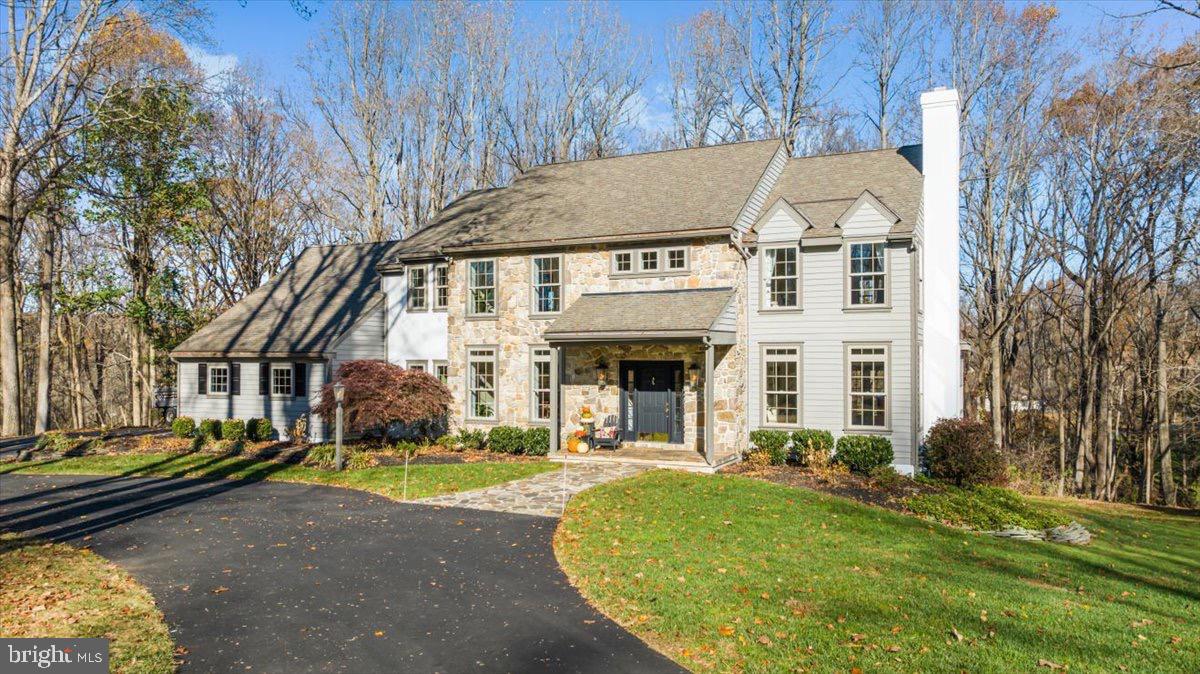 Welcome to a peaceful retreat in the award-winning Unionville-Chadds Ford School District! Nestled on a private one-acre lot at the end of a tranquil cul-de-sac in Waterglen, this stunning home features all new Anderson windows and sliding glass doors. The home combines the charm of a classic Pennsylvania farmhouse with thoughtful updates and modern comforts. Built in 1990, its stone, cedar, and stucco exterior welcomes you into a warm, light-filled interior where timeless details meet today’s conveniences.

The open main level is the heart of this home, featuring beautifully refinished hardwood floors, and elegant crown molding and wainscoting throughout. The spacious kitchen is a chef’s dream, with Subzero appliances, a Thermador cooktop, granite countertops, and a gorgeous marble backsplash. An adjacent eat-in area opens directly onto the massive deck, stretching over 50 feet and overlooking private, wooded views—perfect for outdoor dining, relaxing, and endless entertaining.

The main level also boasts a cozy family room with a vaulted ceiling, built-ins, and a stunning stone fireplace, along with a formal dining room and an open study equipped with custom bookcases and a charming window seat. Upstairs, you’ll find five bright, comfortable bedrooms, including a luxurious primary suite with a spa-like marble bathroom and a custom walk-in closet. Each room is designed to capture natural light and scenic views.

A finished basement offers even more space for hobbies, work, or play, with areas for a home office, rec room, or crafting. Outdoors, lush landscaping and a natural gas hook-up for your grill make the backyard a perfect spot for gathering with friends and family. Plus, this home’s West Chester location gives you quick access to fantastic shopping, dining, and parks while enjoying a private, neighborhood feel.

With its spacious design and upscale details, 1662 Waterglen Drive is a true sanctuary—a place to relax, entertain, and make lasting memories. Welcome home!