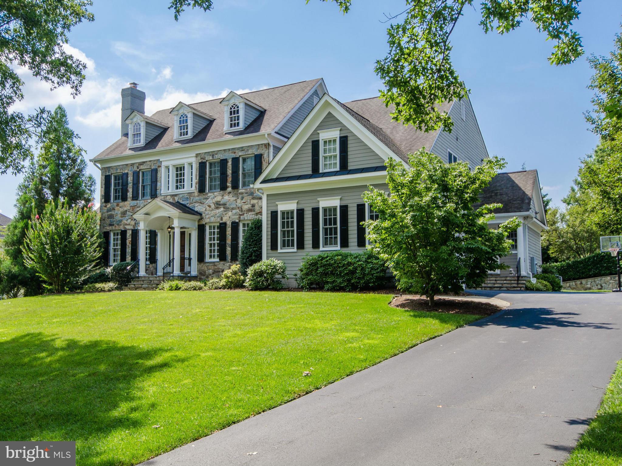 This is the McAuley Park house you've been waiting for!!   Fantastic open living space w/ main level study, gorgeous  sunroom, covered porch, 5 BR's up, w/ amazing master suite, huge LL w/ wet bar, gym, storage galore, very private flat backyard, top of the line finishes, 3 car garage next to mudroom/kitchen, on & on.  Walk to Mercy, Congressional CC & more!