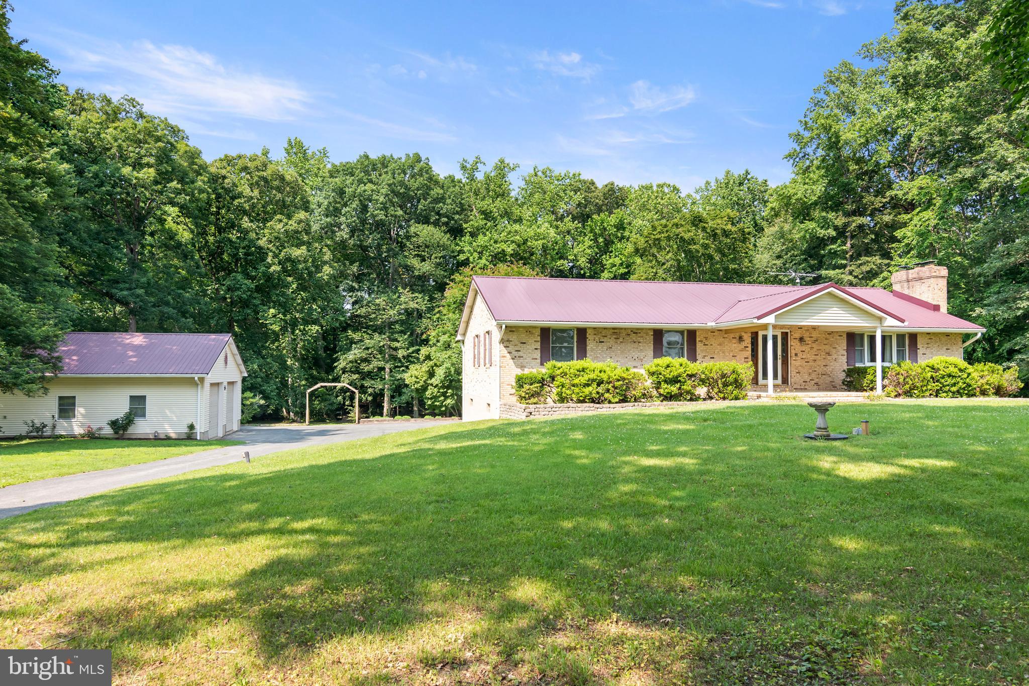 **PRICE IMPROVEMENT**
PARK LIKE SETTING- MATURE TREES- CREEK- BRIDGE ALL ON 3.064 PRIVATE ACRES***  Meticulously Maintained 3/4 bedroom,  3 bath home,  With  Bonus Room or Possible in-law/Au Pair Suite with Wheelchair access doors and a Chairlift for easy upstairs living access.  Private in ground Pool with Gazebo. 
 Woods in back half of property with your own Creek and Bridge to access back half of property.  Front and back of property are surrounded by Farm Land.   *Bonus* RV PARKING SITE with Water, Electric and Septic disposal.
Come make this Beautiful Home your own- 1st time on market- You don't want to miss this opportunity.  Easy access to Restaurants and Shopping.  Minutes to Downtown Easton, Hour to Annapolis, 30 Minutes to Kent Island and 1  1/2 hours to Beaches!  *** See if your children can find the Gnome!! (Some photos have been virtually staged.)