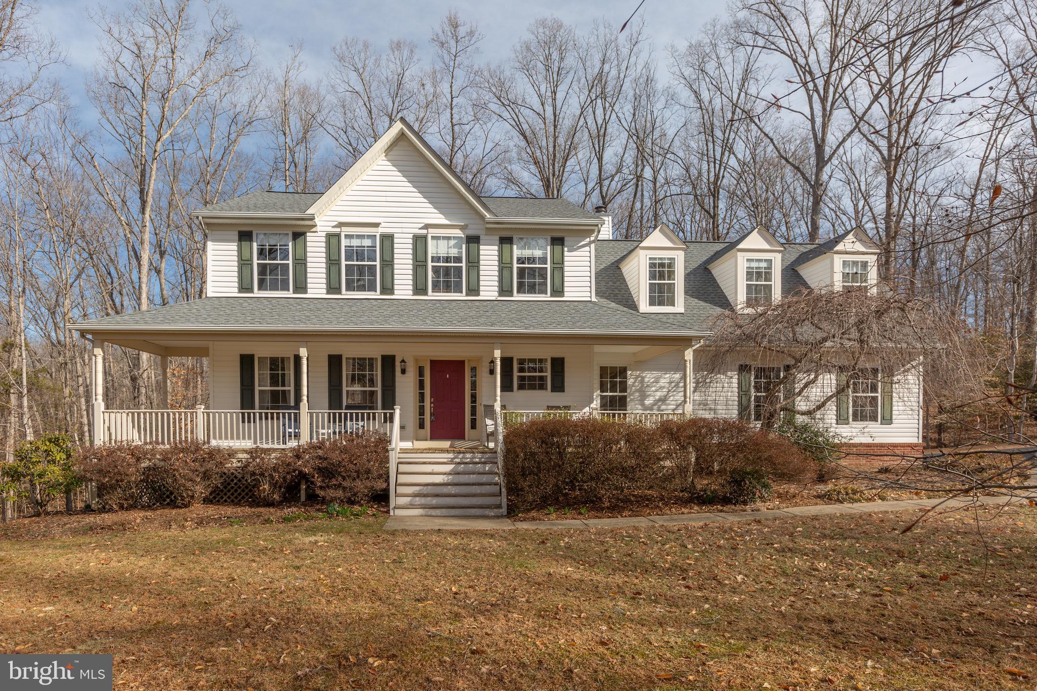 BEST OF BOTH WORLDS! 3 Peaceful Wooded Acres of Privacy and EASY ACCESS to Shopping & Transportation! UPDATED AND UPGRADED! This Beautiful 4-bedroom Piccard Colonial is MOVE-IN READY, and features a welcoming Front Porch, Side Load Garage with Extended Driveway and Exceptional Upgrades Throughout - including a Recent Roof!  Beautiful contemporary LVP Flooring spans both the main and upper levels! Thoughtfully designed living spaces make every room inviting as you enjoy woodland views throughout the home! The Main Level includes a Living Room, Dining Room, Gourmet Eat-In Kitchen, Family Room, convenient Half Bathroom, and Laundry Area. The Stylish and Functional Kitchen has been upgraded, boasting additional Cabinetry for ample Storage, Granite Countertops, Stainless Steel Appliances, and more! Off the Kitchen is the Family Room featuring a charming Fireplace and Built-in Bookcases, creating a perfect space for relaxation and gatherings. The upper level has 4 generously sized bedrooms and a versatile bonus area, perfect for a sitting nook, playroom, recreation space, hobby corner, etc. The spacious Primary En-Suite is a true retreat, featuring 2 closets and a Beautifully Renovated Bathroom complete with a double vanity, soaking tub, and a separate shower.  From the family room and kitchen step directly out to a Tiered Deck with stairs to your own Private Backyard Oasis.  The backyard offers open green space and a tranquil wooded backdrop, creating the perfect setting for relaxation, entertaining, and enjoying nature. The walk-out finished basement is a versatile space featuring a recreation area, a half bathroom, ample storage, and more—perfect for entertaining, a home gym, or a guest suite!  Make an appointment to see this home today!