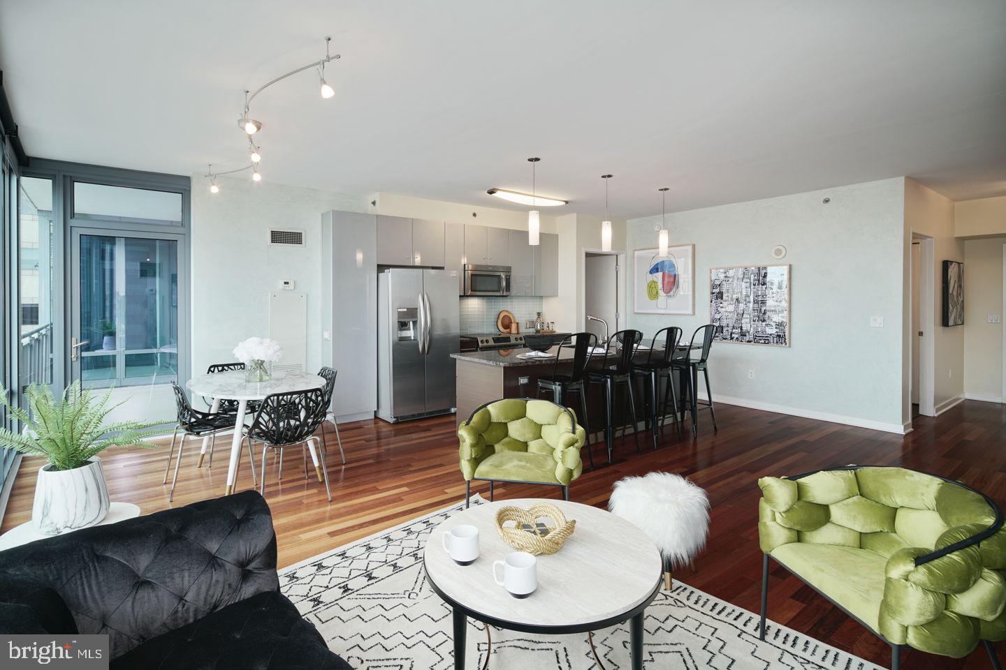 PARKING AND STORAGE INCLUDED! A spacious and luxurious condominium with amazing North and West facing views. This beautiful 1-bedroom, 1.5 -bath residence features hardwood floors throughout inclusive of the bedroom! Custom shelving system with oversize walk-in closet in the master along with the closets in the entryway. Added cabinetry in the kitchen for more storage! Custom blinds in the living room with Murphy bed that will accommodate any guest! Modern and luxurious granite countertops, stainless steel appliances, 9-foot ceilings with floor to ceiling windows. The price includes a reserved parking space in the attached covered garage, and a storage locker. The building features a 24HR Concierge, fitness center, a heated 60FT lap pool, renovated sundeck/community room and much, much more! The building is situated conveniently next door to Trader Joes and Wine & Spirits - and is just walking distance from Philadelphia's top-rated restaurants. Spend the day shopping in Rittenhouse, or enjoying the sights at Boathouse Row, you can't beat the location and attractions located right near the Murano! Don't miss out on this unit!