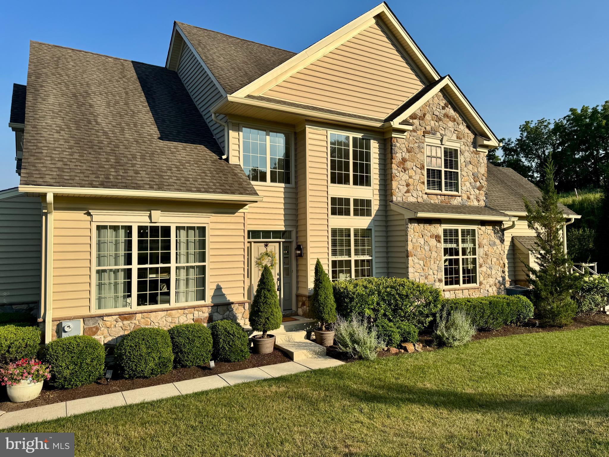 Welcome to this exceptional 3-bedroom, 2.5-bath carriage home in the sought-after Creekside section of Byers Station, located within the award-winning Owen J. Roberts School District. Nestled in one of the community's most desirable locations, this home offers one of the best and most private views in all of Byers Station while being just steps from the extensive community walking trail network. Creekside is a charming enclave within Byers Station, offering a peaceful setting with easy access to the neighborhood's outstanding amenities.

Enter through the impressive two-story foyer into a thoughtfully designed floor plan featuring upgraded flooring throughout the main living areas. The gourmet kitchen is beautifully appointed with upgraded cabinetry and finishes, abundant counter and cabinet space, and newer Bosch dishwasher and refrigerator. The open layout flows effortlessly into the dining area and spacious living room, where a stunning stone fireplace serves as the focal point, creating a warm and inviting atmosphere for everyday living and entertaining.

The highly desirable first-floor primary suite features a spacious walk-in closet and a luxurious en-suite bathroom with an expanded walk-in shower. A convenient powder room and access to the attached two-car garage complete the main level.

The upgraded staircase, enhanced with custom molding, leads to a versatile loft overlooking the foyer—perfect as a second family room, home office, or reading retreat. Two generously sized bedrooms, each featuring walk-in closets, share a full hall bathroom. A dedicated storage room and additional hall closet provide ample storage space.

Significant mechanical updates provide added peace of mind, including a new HVAC system, tankless water heater, and water softening system, all installed in 2025.

Residents of Byers Station enjoy resort-style amenities including a clubhouse, swimming pool, tennis courts, tot lots, playgrounds, and miles of scenic walking trails. Conveniently located near shopping, dining, major commuter routes, and everyday conveniences, this beautifully upgraded carriage home offers the perfect combination of luxury, privacy, and low-maintenance living in one of Chester County's premier communities.