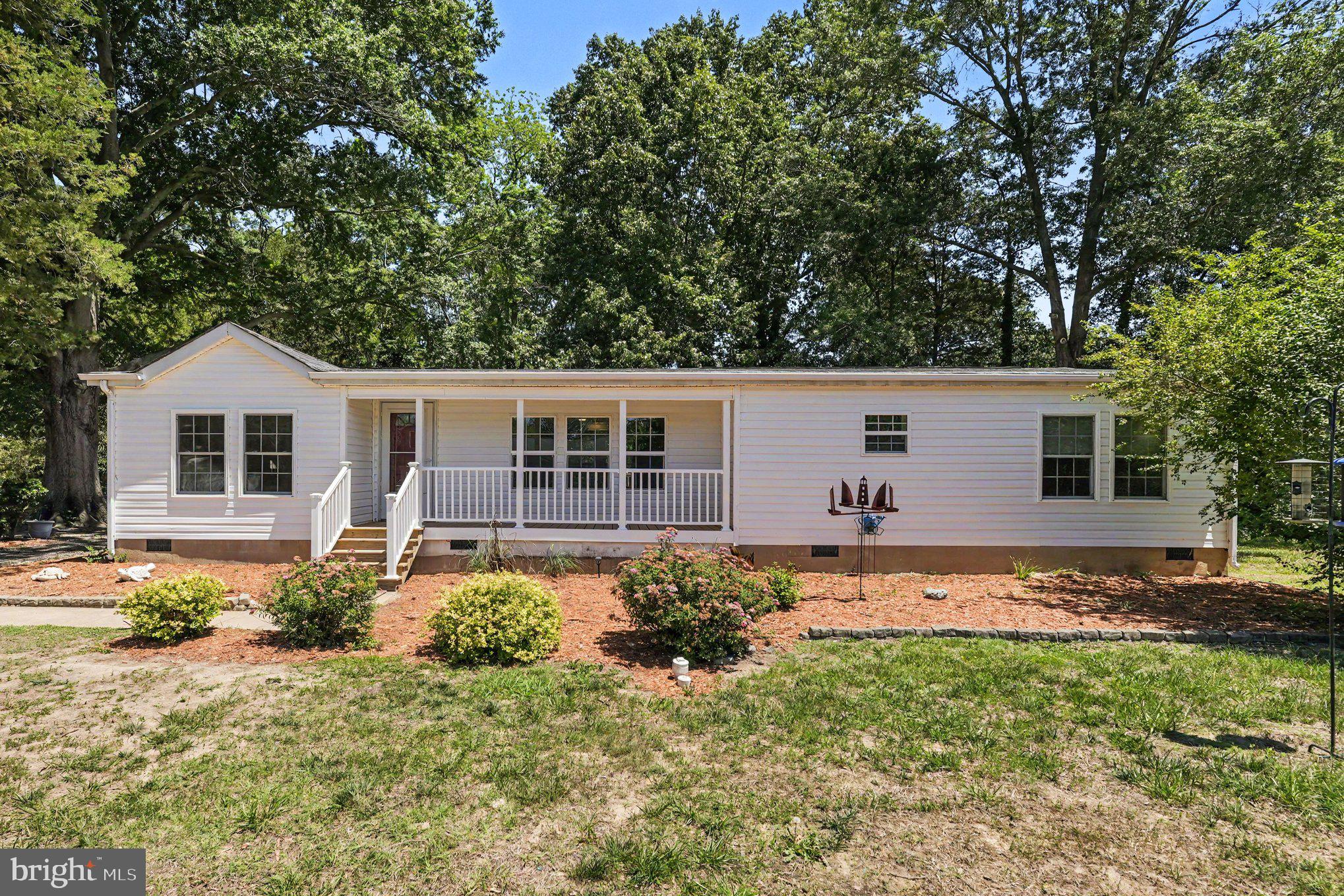 Recently remodeled, this home sits on a spacious .55 acre lot in the Bluff Point area of Colonial Beach.  Home offers comfortable one-level living, a desirable open floor plan, and lots of recent updates---new roof, interior painting; kitchen upgrades--center island and granite countertops, new refrigerator, range and dishwasher; bathroom updates, landscaping, new storm door on rear entrance; as well as new flooring and some upgraded lighting.   This home has a solid foundation with crawlspace, and the front porch was recently replaced.  There is a rear deck for privacy while you enjoy the fully-fenced backyard and mature shade trees. There are two storage sheds with electricity and ample parking for vehicles, boats and RVs. Colonial Beach is a Golf Cart-friendly town and the golf cart trail is located close by.  Restaurants, marinas, shopping and the downtown beaches are just minutes away.  Get in on the fun in this charming riverfront town!