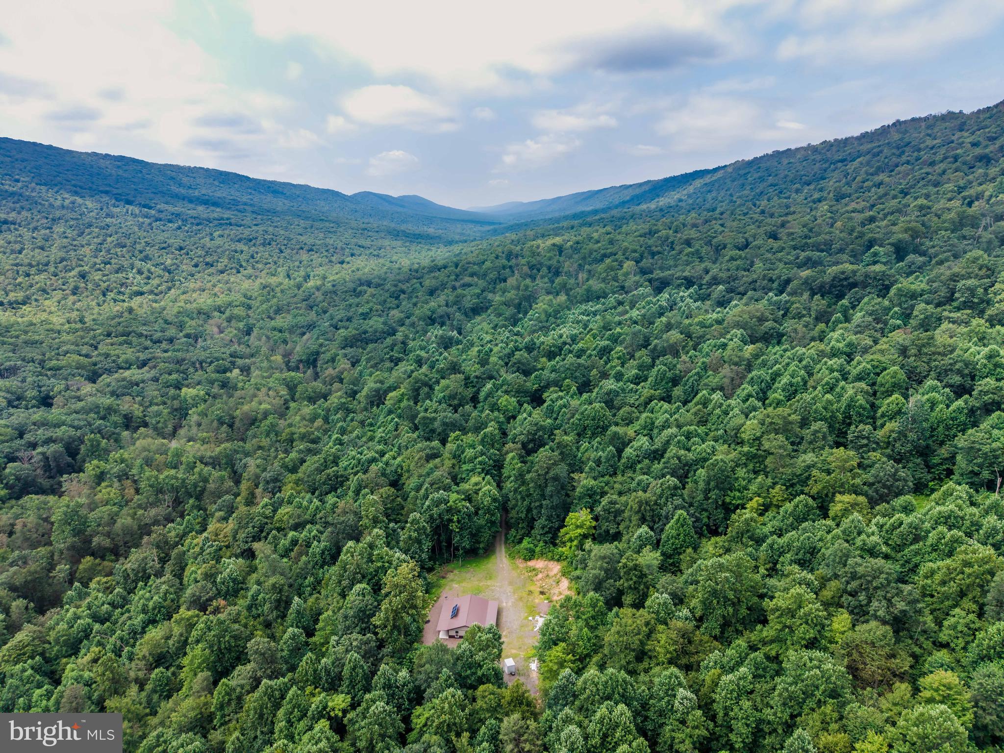 55.5 Acres with Off-Grid Cabin in Tuscarora State Forest – Surrounded by State Game Lands

Escape to 55.5 acres of rugged beauty tucked deep in Tuscarora State Forest, just outside of Mifflintown. This remote property is a rare find for hunters, outdoorsmen, and anyone seeking true solitude. At its heart sits a rustic off-grid cabin, fully equipped for extended stays with solar power, an on-site septic system, and a natural spring-fed water source.

Currently used for hunting and recreation, the land is bordered by thousands of acres of state game lands, offering nearly unlimited access to public hunting and exploration. A peaceful creek runs just beyond the bottom of the property, adding to the tranquil setting without being part of the parcel.

Whether you're looking for a turnkey hunting camp, a weekend getaway, or a self-sufficient escape into nature, this property offers unmatched privacy, adventure, and potential.
