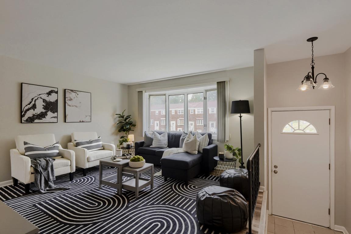 Rare Opportunity! Fashion and Function Collide right here at 938 Circle Drive.  Welcome to this beautifully updated brick-front townhome in Halethorpe, where modern elegance meets comfortable everyday living. Filled with natural light, this move-in-ready home offers a warm and inviting atmosphere from the moment you open the door. The kitchen is designed to impress, featuring warm oak cabinetry, new stainless-steel appliances, double sinks, generous storage, and a functional flow into the dining area—perfect for everyday meals and entertaining alike.

The bright and spacious living areas provide comfortable gathering spaces, while the updated full bathroom and refreshed bedrooms offer stylish retreats for rest and relaxation. The fully finished lower level adds valuable living space with a convenient half bath, utility room, and walk-out access to the backyard.

Step outside from the kitchen onto the rear deck, creating an easy transition between indoor and outdoor living. The fenced backyard offers the best of both worlds—charming brick accents, green space to enjoy, and direct access to two private off-street parking spaces. Conveniently located with easy access to major commuter routes, shopping, dining, and local amenities, this turnkey home is ready for its next owner to move in and enjoy. Looking forward to helping you make this house your new home.